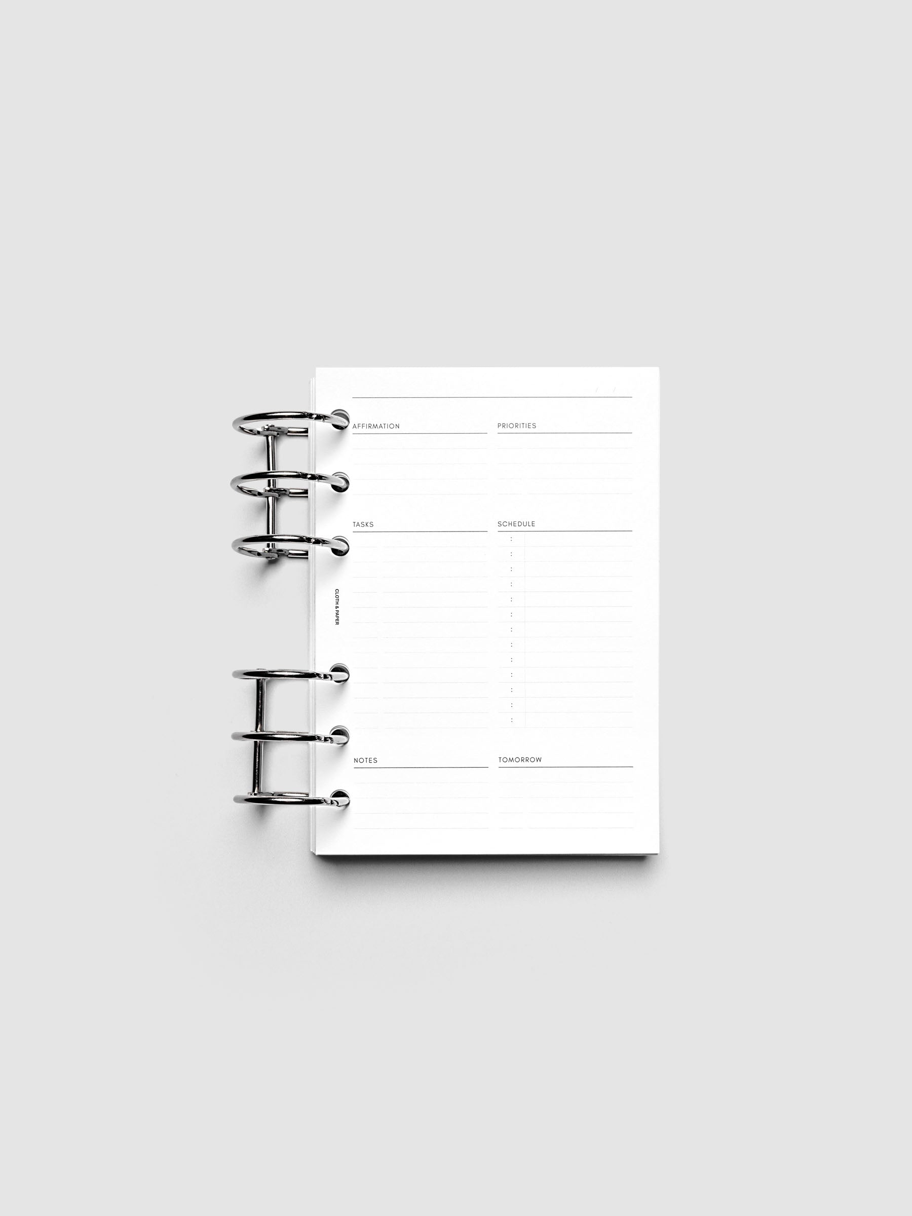 Daily Essentials Planner Inserts shown ring bound in size A6.