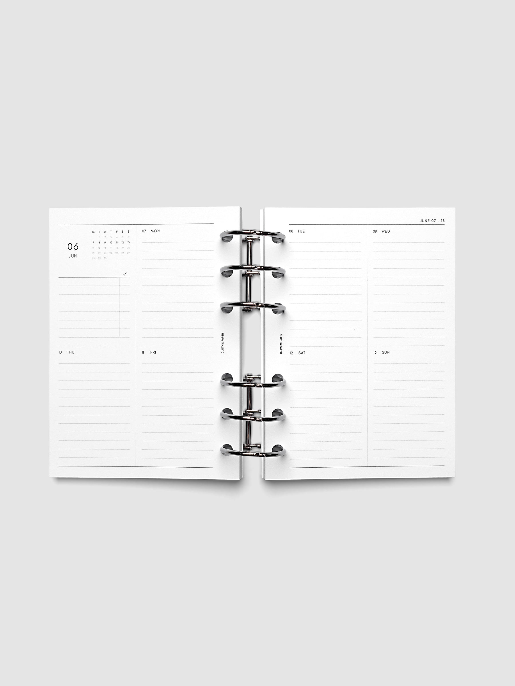 Both pages inside planner: 2027 Dated Weekly Vertical Planner Inserts, Monday Start, A6 6-Ring Punch, full week-on-two-pages spread showing a two-column two-row daily grid with lined sections, mini monthly calendar and task list in the top left, shown inside a planner