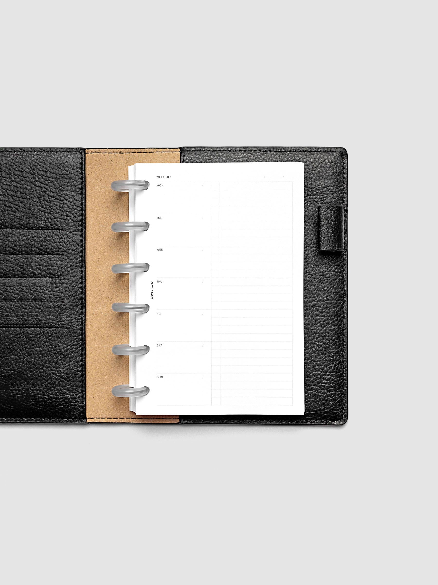 Weekly Checklist Inserts shown discbound in a black folio in size CP Petite.