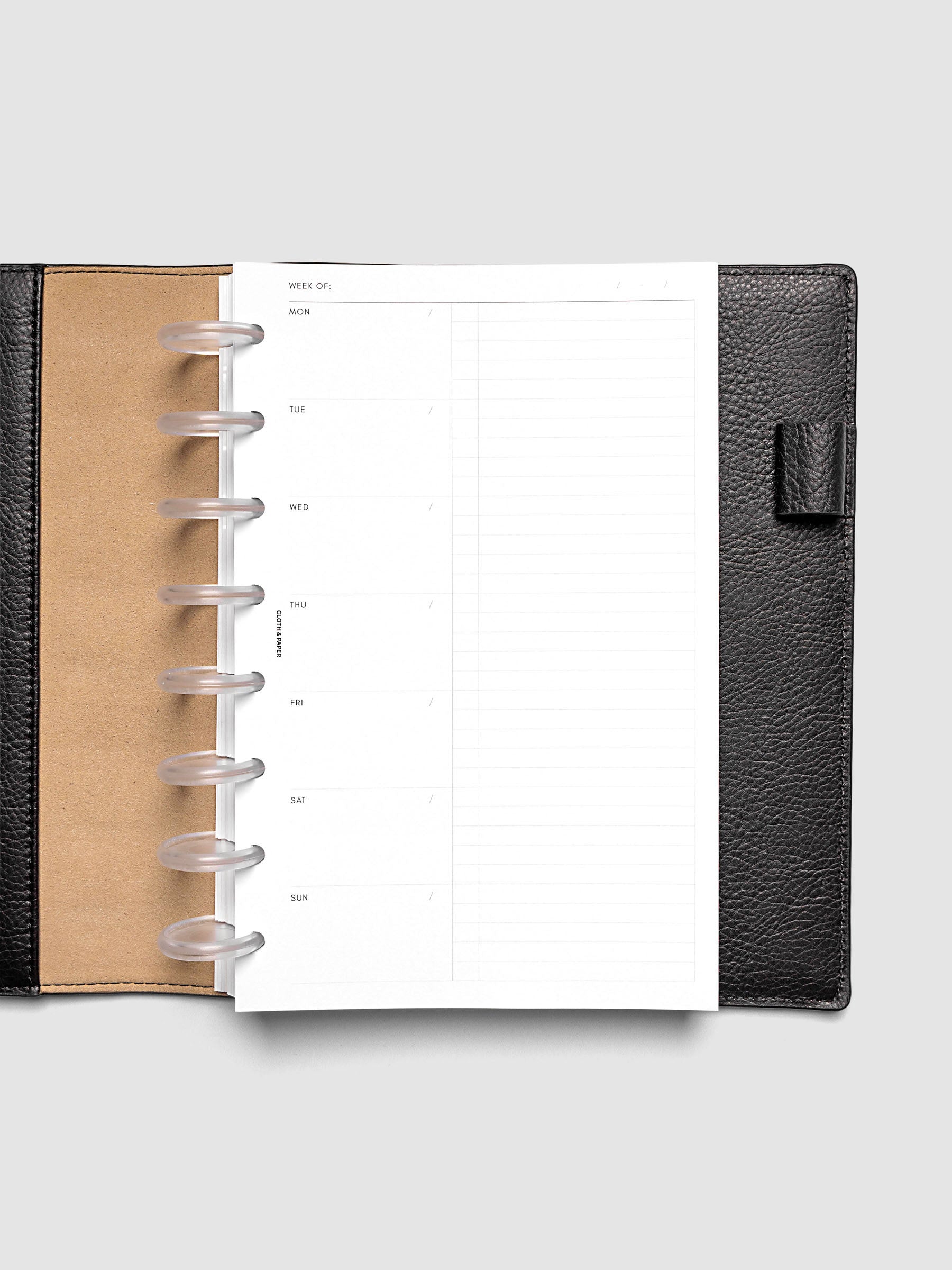 Weekly Checklist Inserts shown discbound inside a black leather folio in size Half Letter.