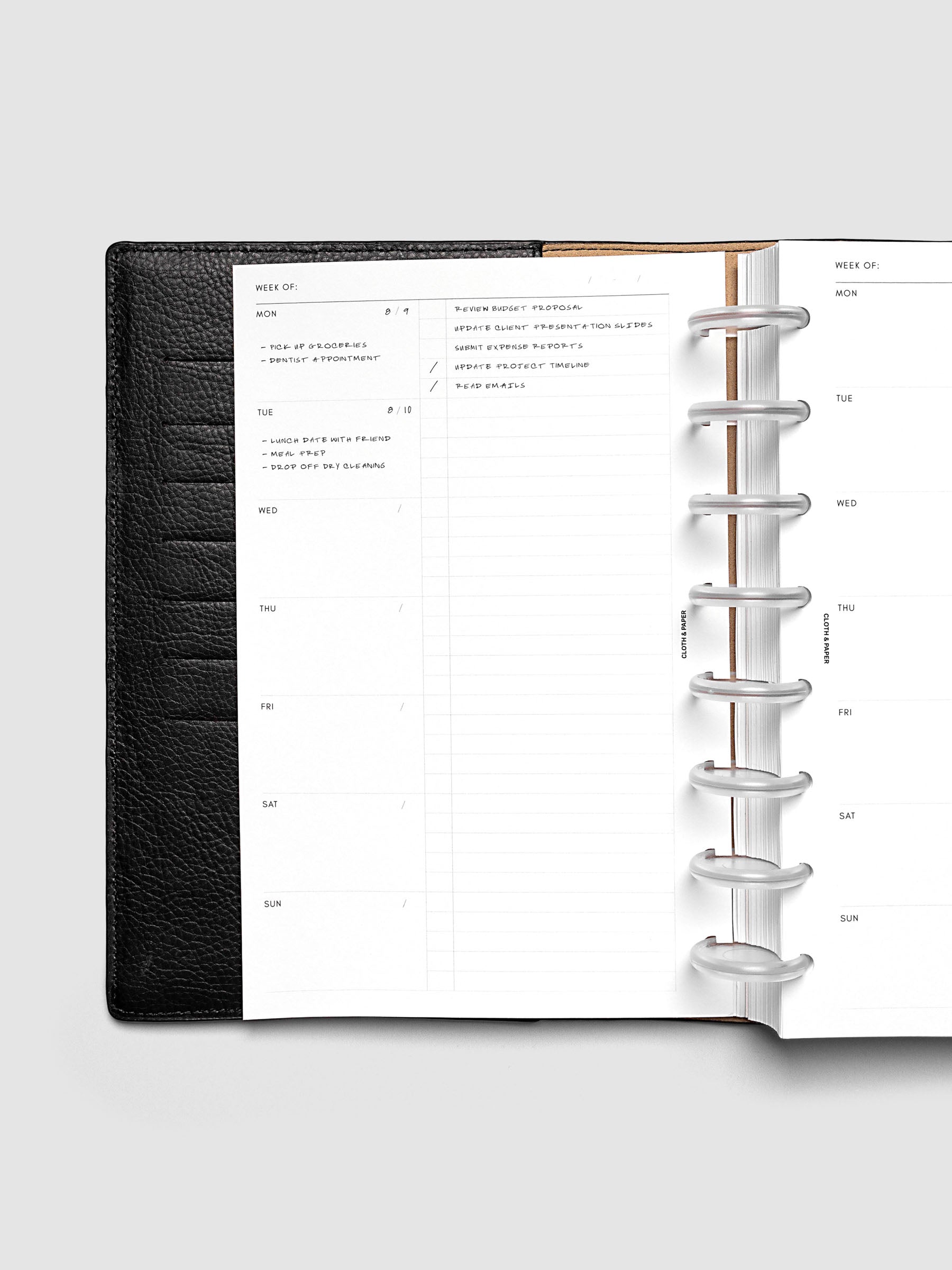 Weekly Checklist Inserts shown discbound inside a black leather folio in size Half Letter.