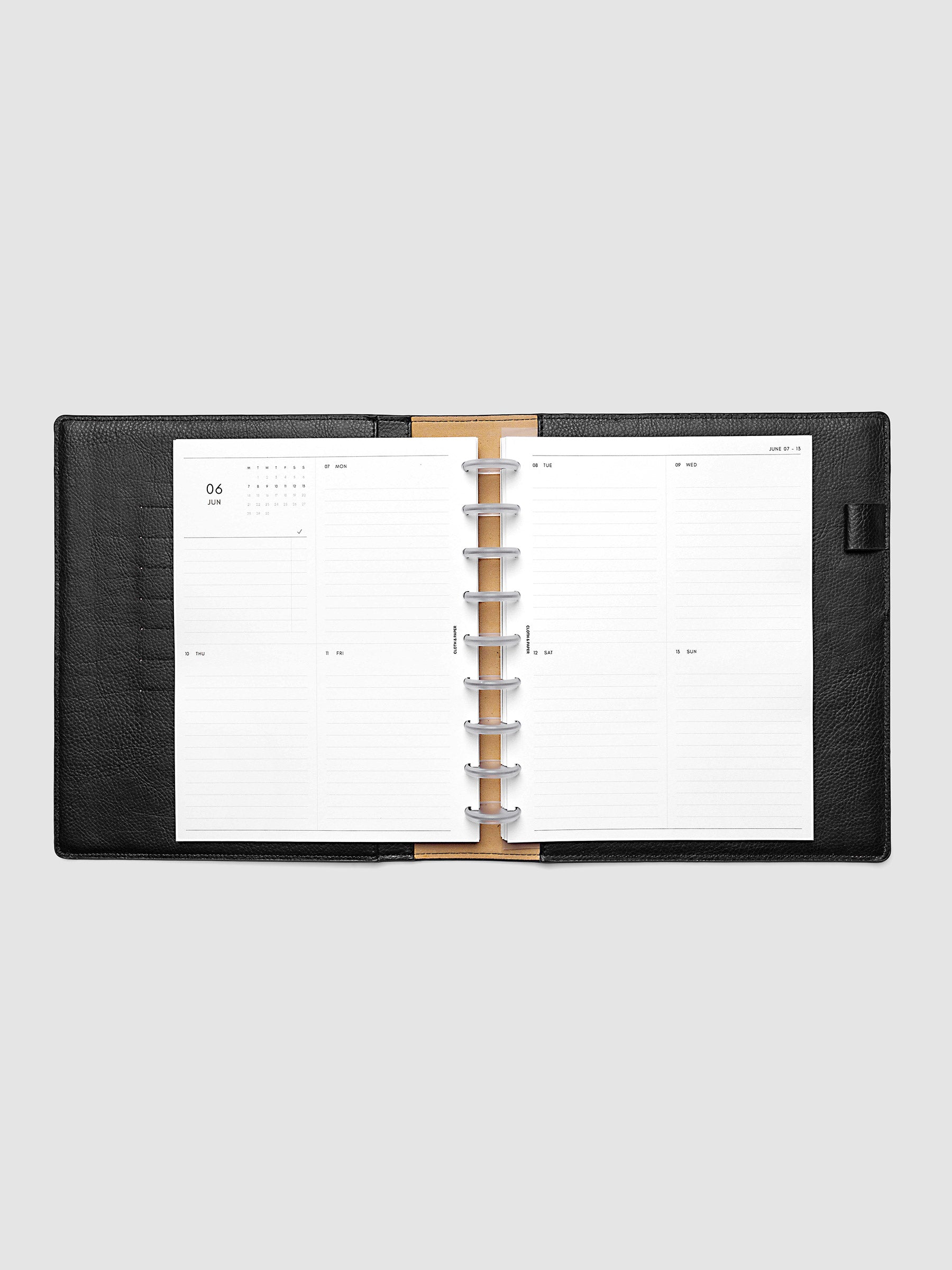 Both pages inside planner: 2027 Dated Weekly Vertical Planner Inserts, Monday Start, HP Classic 9-Disc Punch, full week-on-two-pages spread showing a two-column two-row daily grid with lined sections, mini monthly calendar and task list in the top left, shown inside a planner