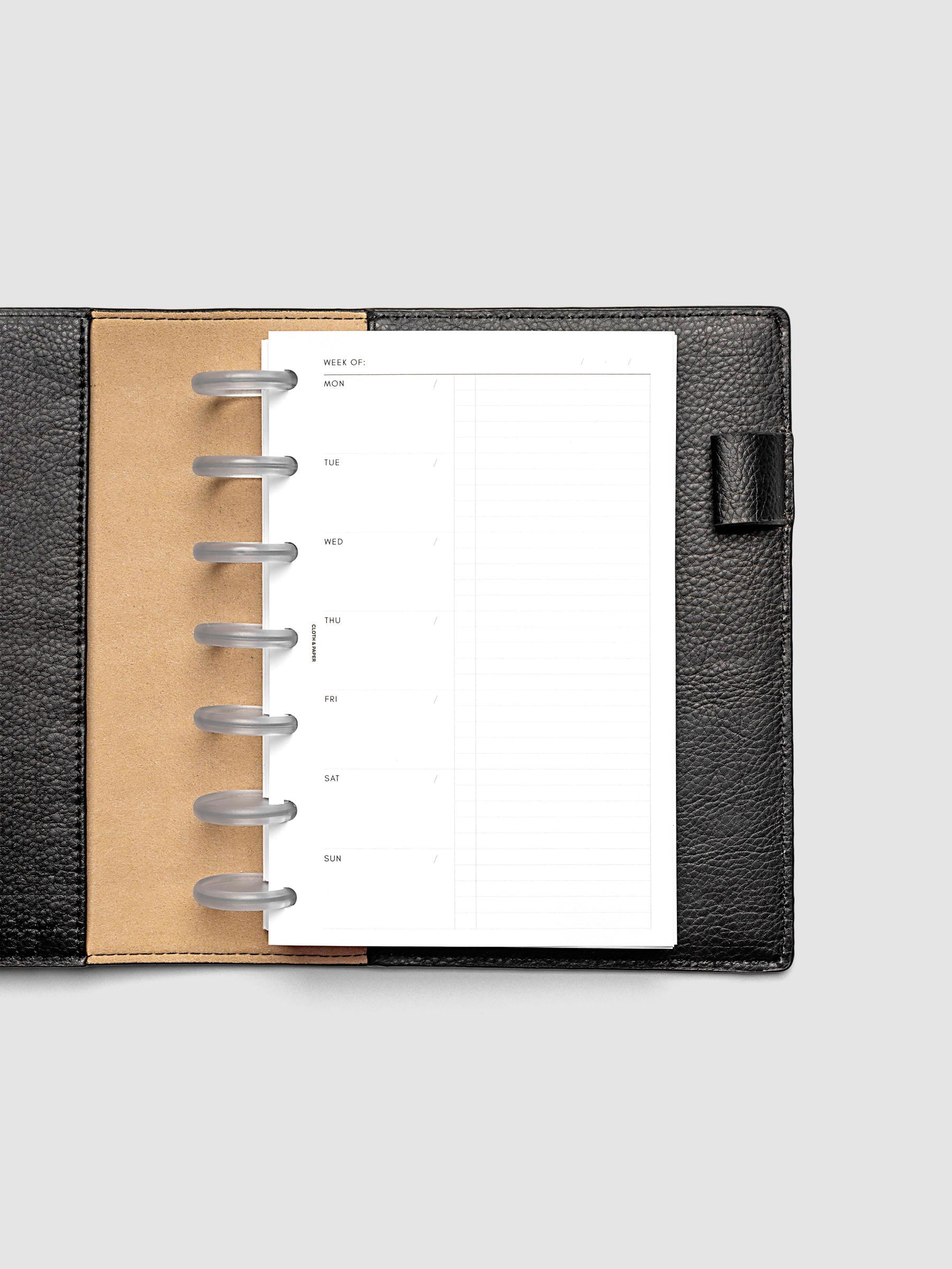 Weekly Checklist Inserts shown discbound inside a black leather folio in size HP Mini.