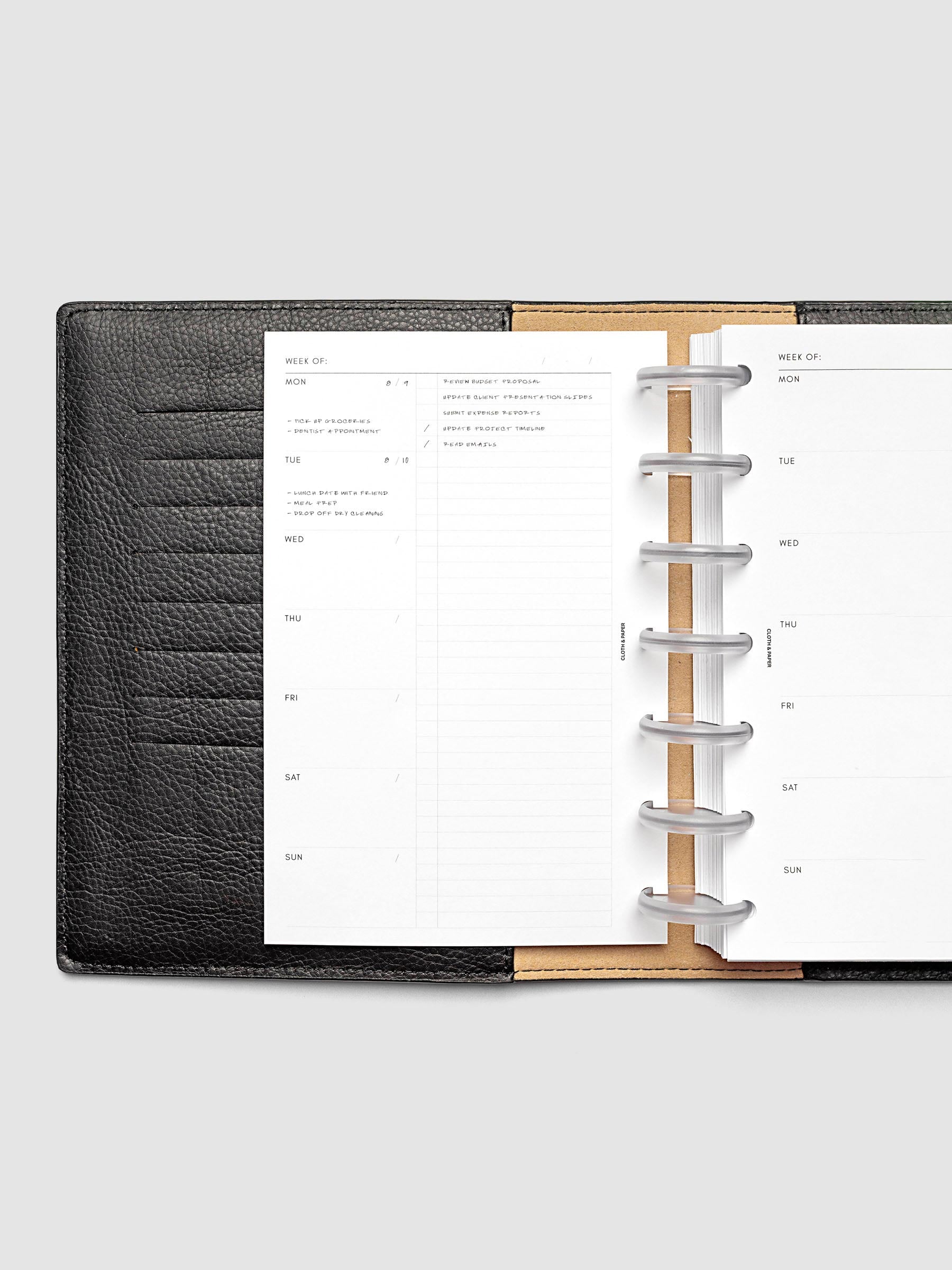 Weekly Checklist Inserts shown discbound inside a black leather folio in size HP Mini.