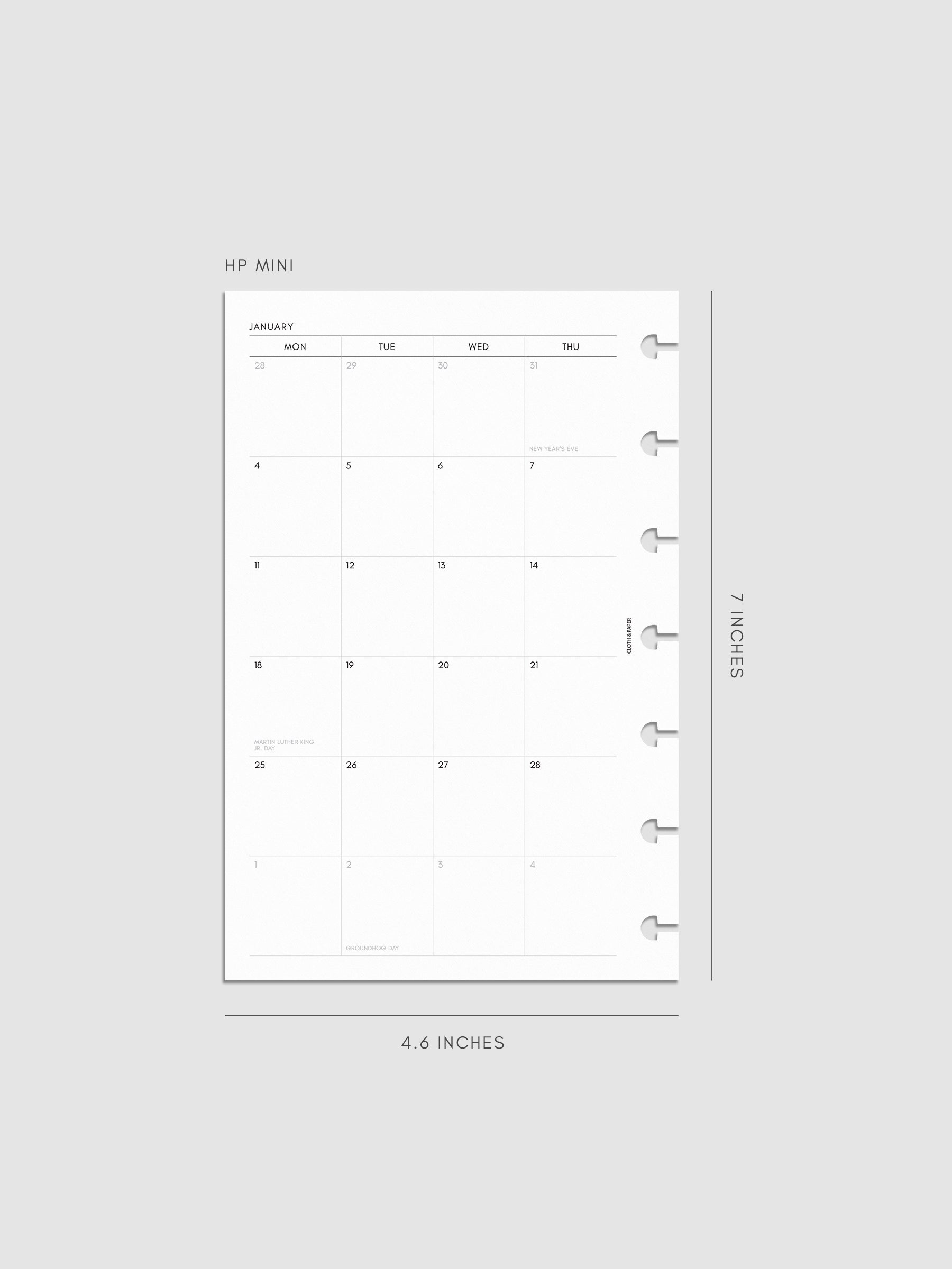 2027 Dated Monthly Planner Inserts, Monday Start, HP Mini 7-Disc Punch, left page of two-page monthly calendar spread with Monday start shown inside a planner