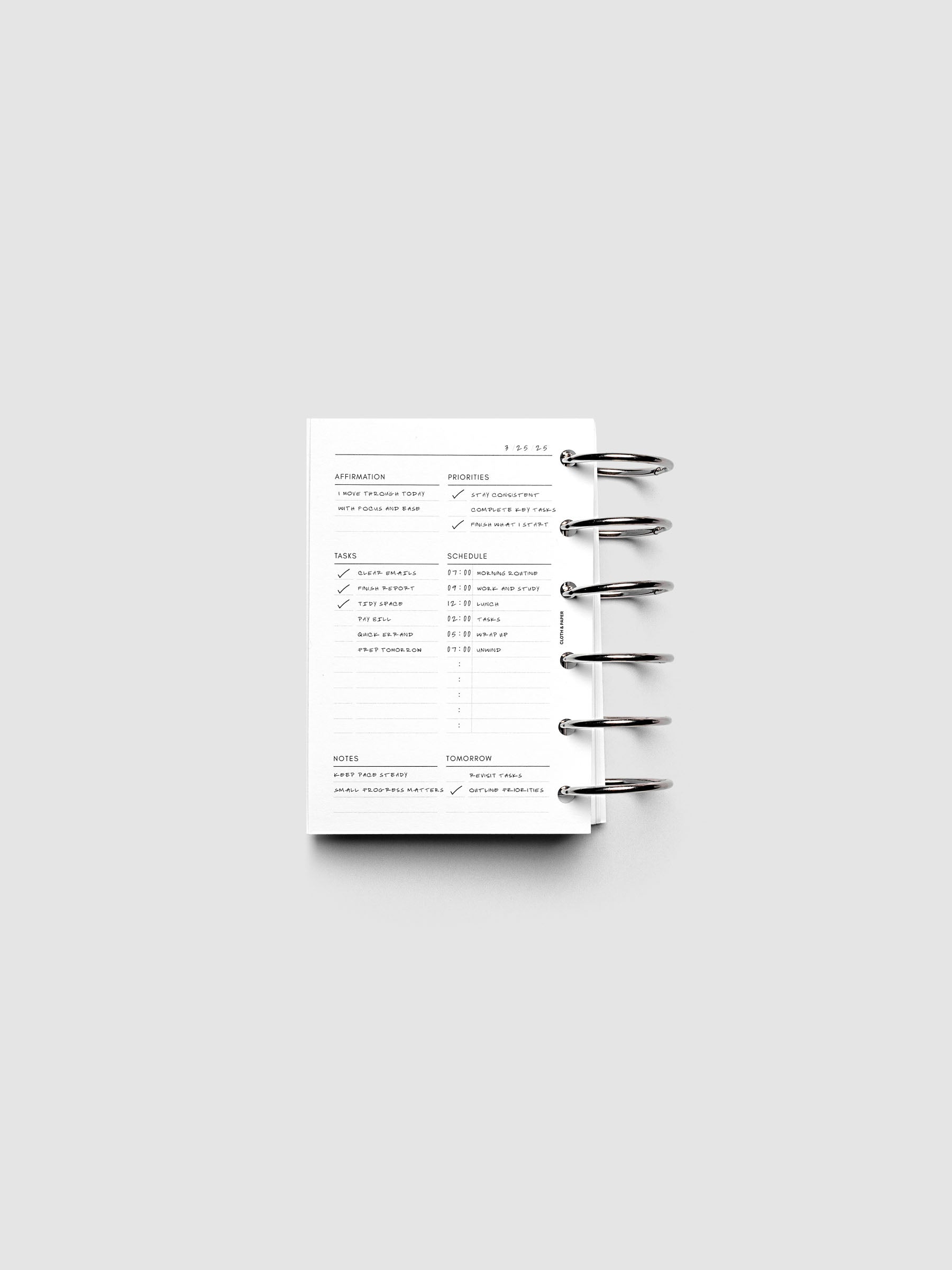 Demo page of the Daily Essentials Planner Inserts shown ring bound in size Pocket.