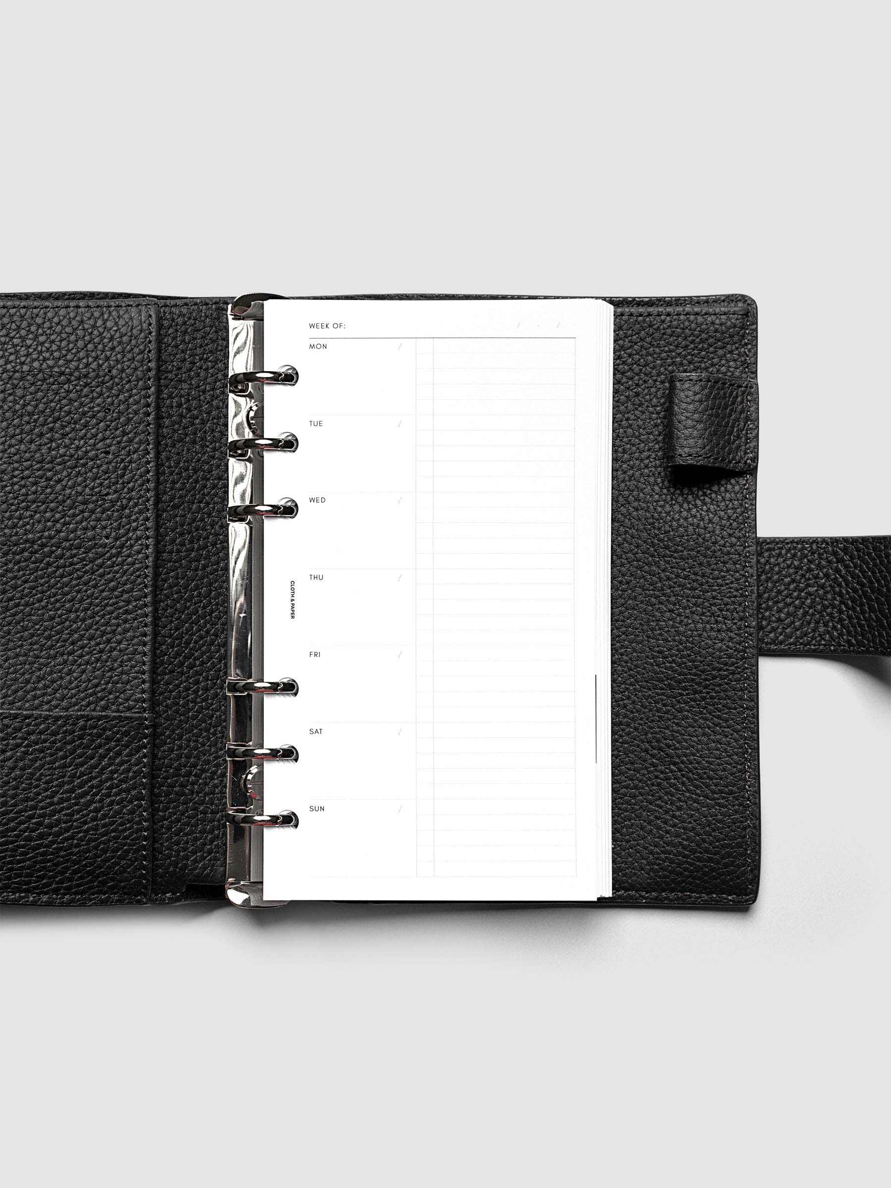 Weekly Checklist Inserts shown in size Personal inside a black leather agenda.