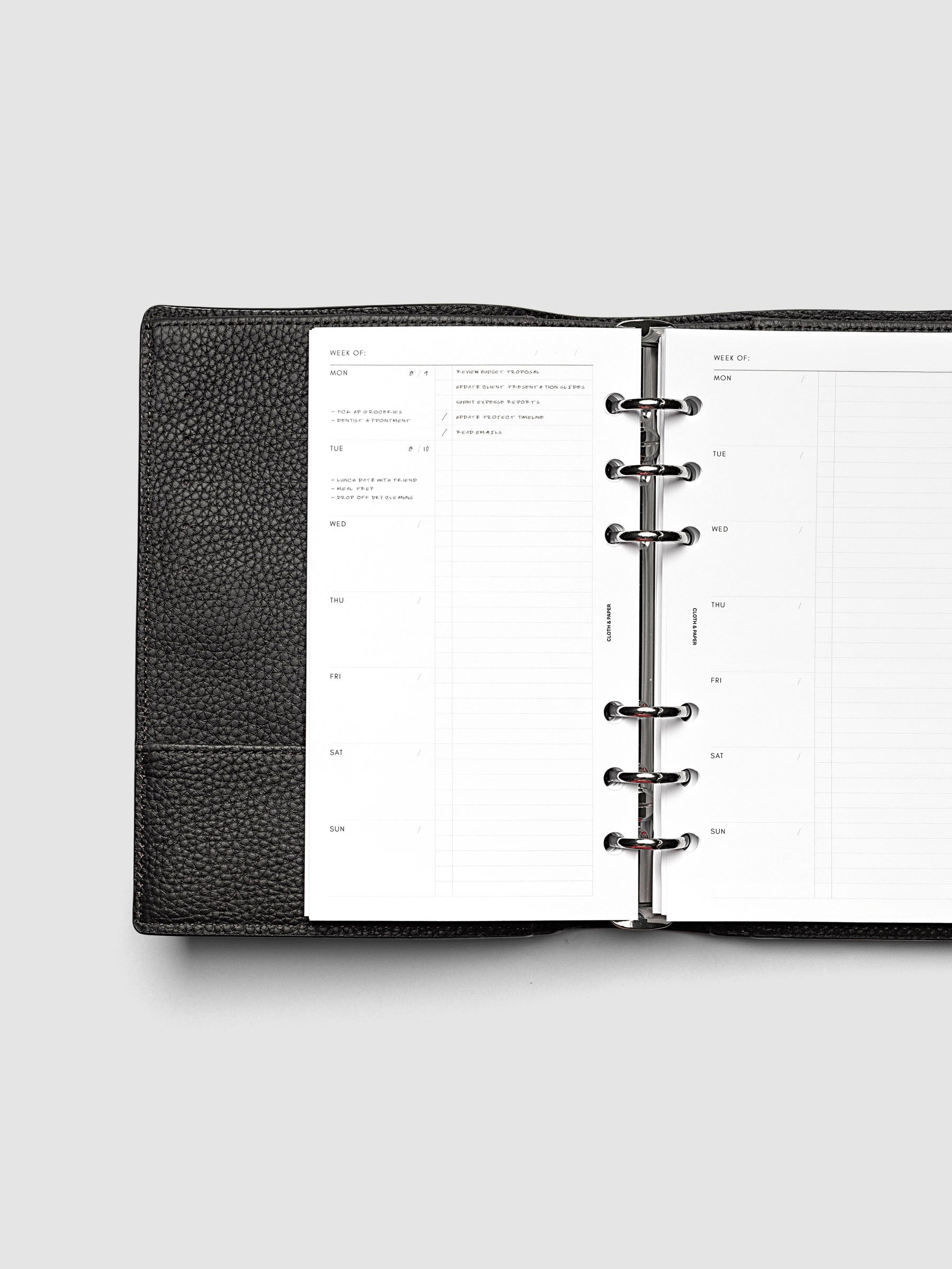 Weekly Checklist Inserts shown in size Personal inside a black leather agenda.