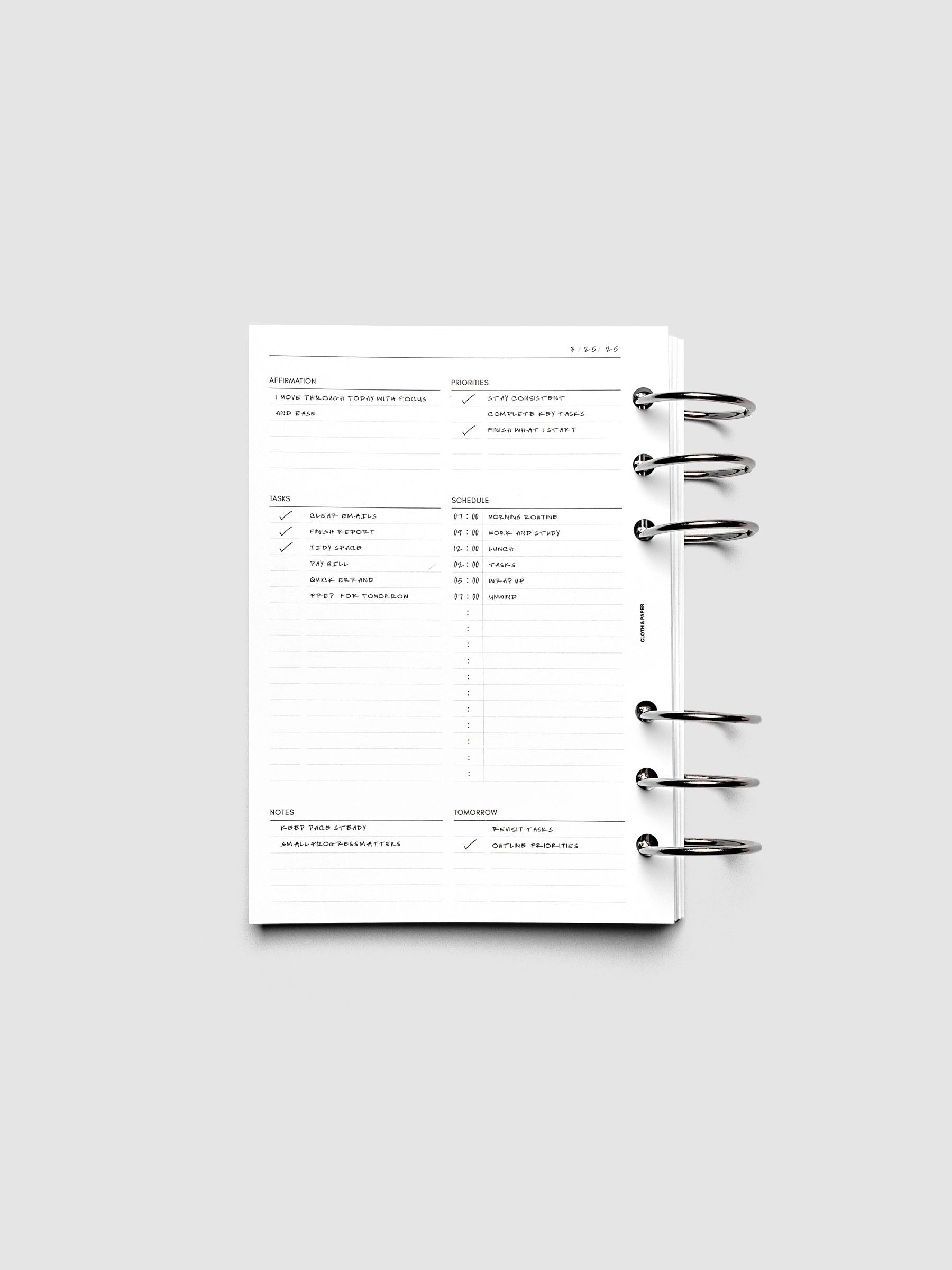 Demo page for the Daily Essentials Planner Inserts shown ring bound in size Personal Wide.