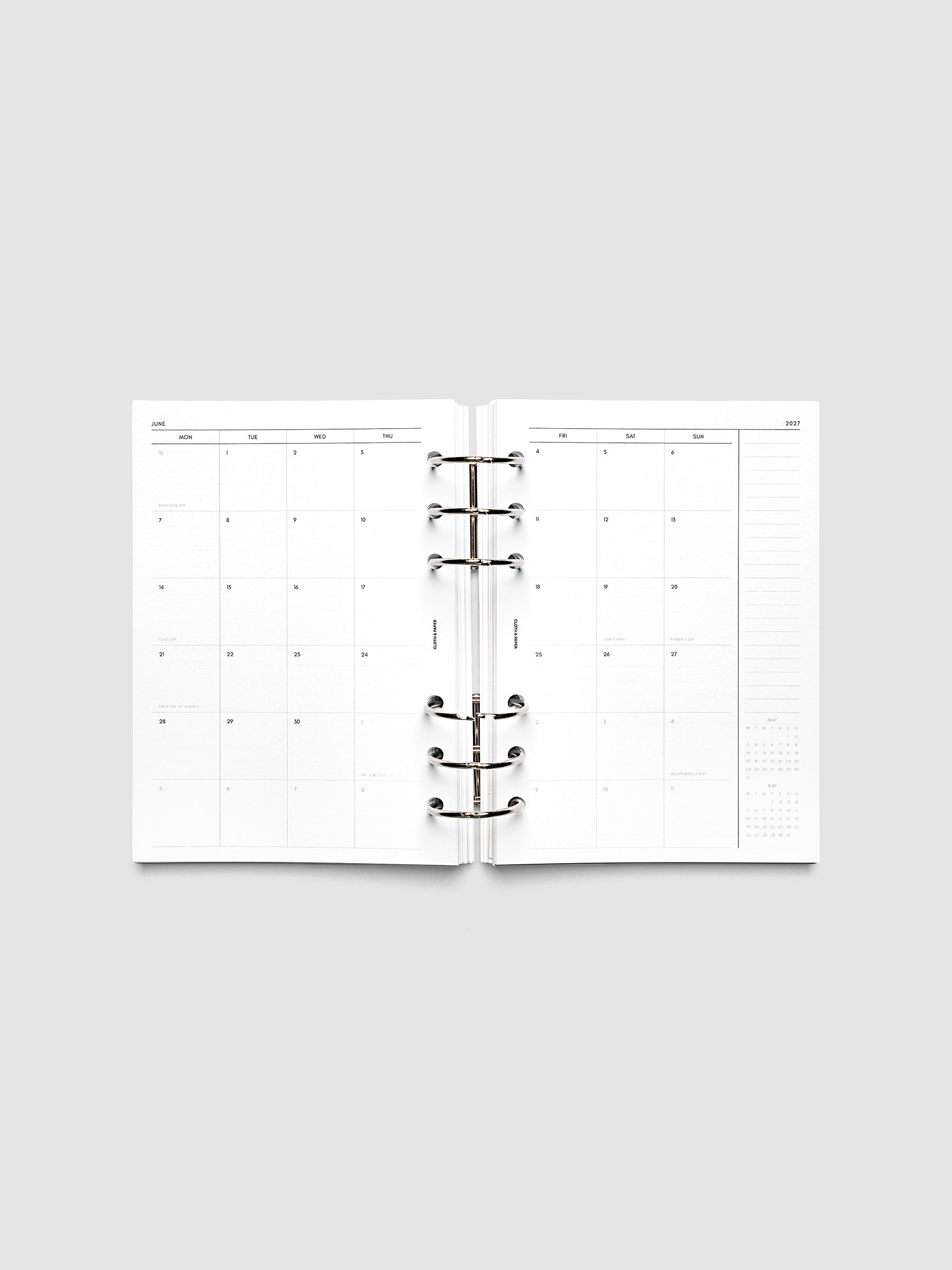 2027 Dated Monthly Planner Inserts, Monday Start, Personal Wide 6-Ring Punch, full two-page monthly calendar spread with Monday start, notes column, and mini calendars in the bottom right corner shown inside a planner