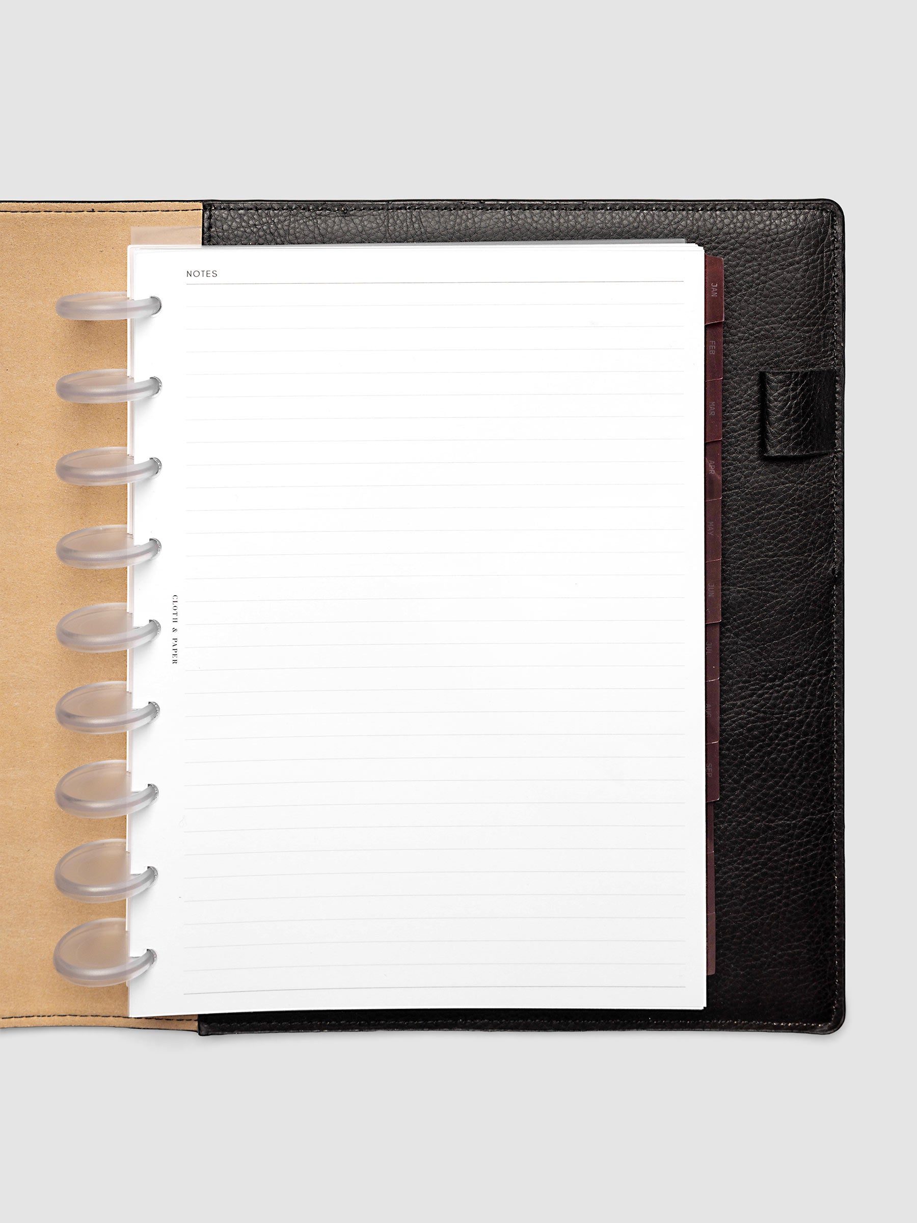 HP Classic 9-Disc Punch Ultra-Thin Monthly Dividers in deep red shown tabbed inside a planner