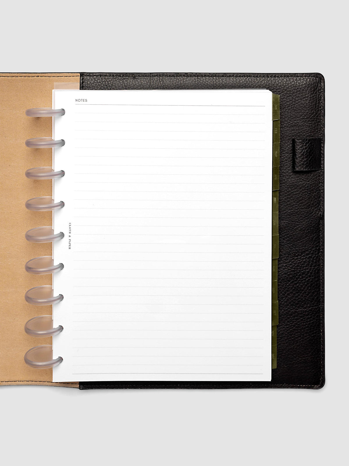 HP Classic 9-Disc Punch Ultra-Thin Monthly Dividers in olive green shown tabbed inside a planner
