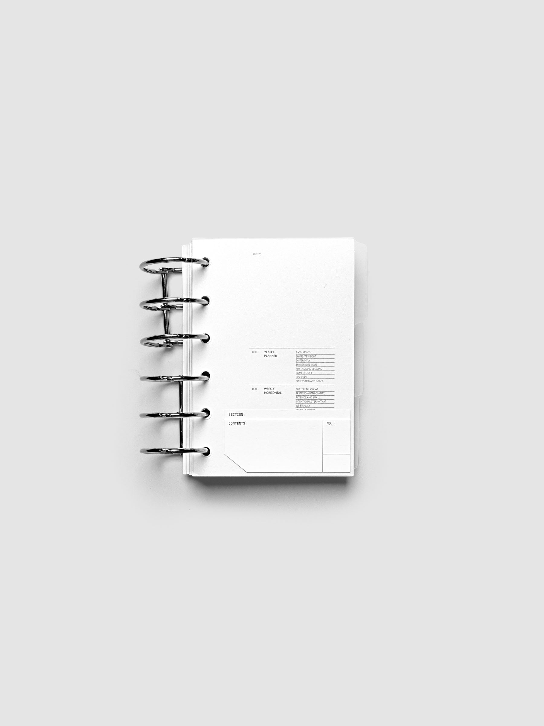 Clear side tab dividers sized for Pocket planners shown in use with a blank label with headers section, content, and no.