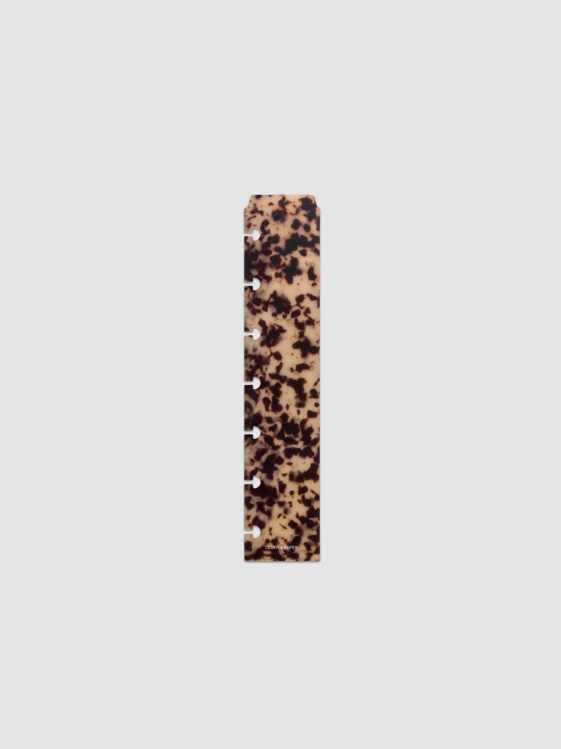 One narrow page marker in tortoiseshell pattern, shown in size HP Mini.