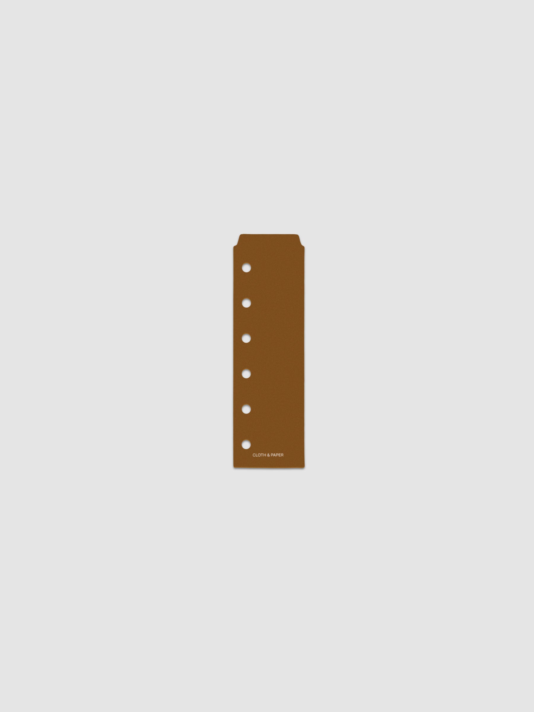 One narrow page marker in brown, shown in size Pocket.