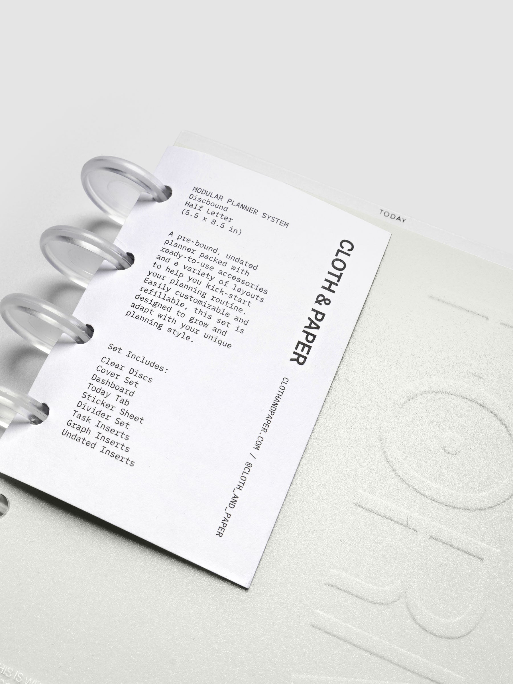Forma Modular Planner System in CP Petite shown on top of Half Letter against a black background.