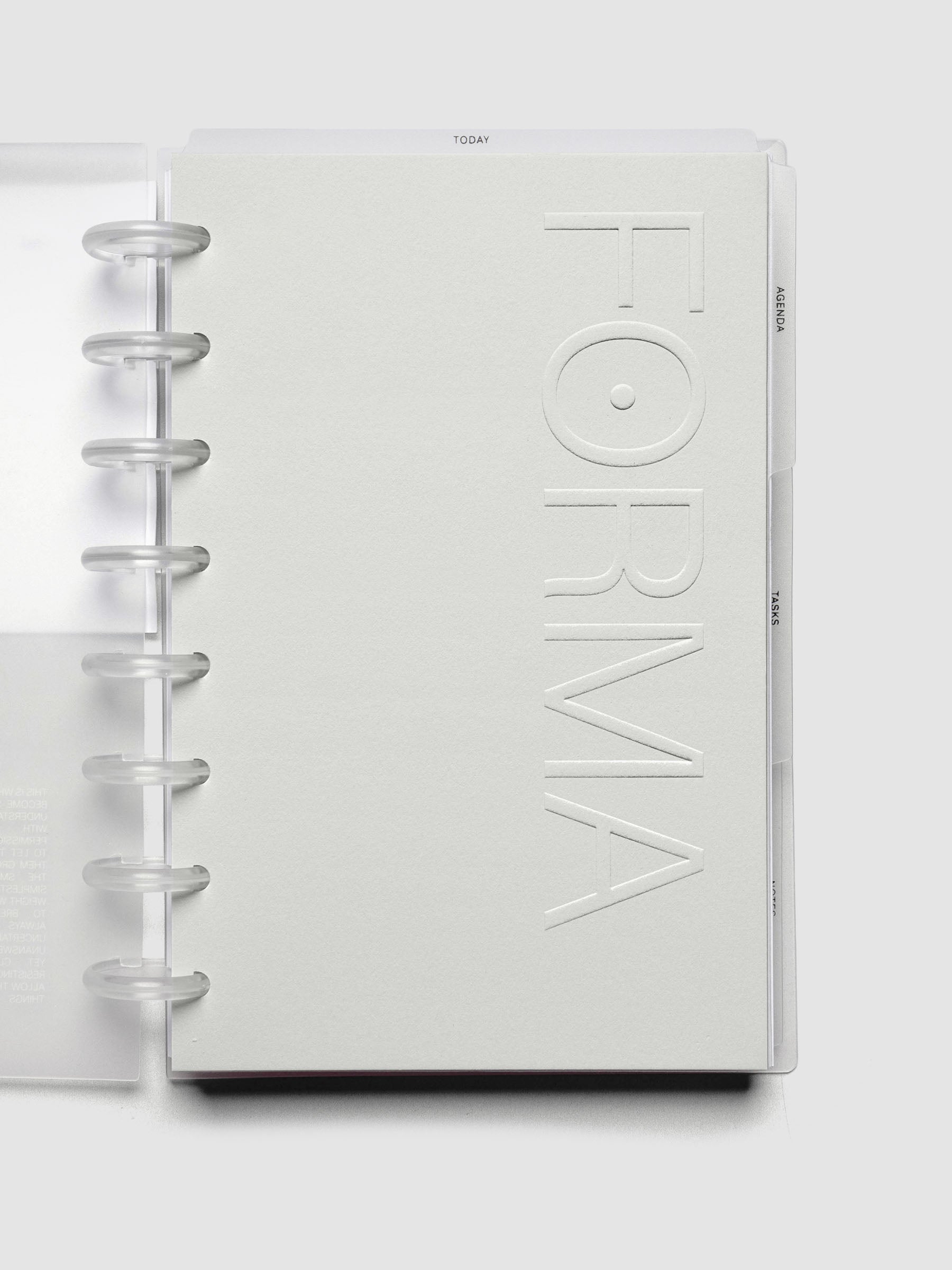 Close up view of the Forma Modular Planner System side tab dividers labeled agenda, tasks, and notes.