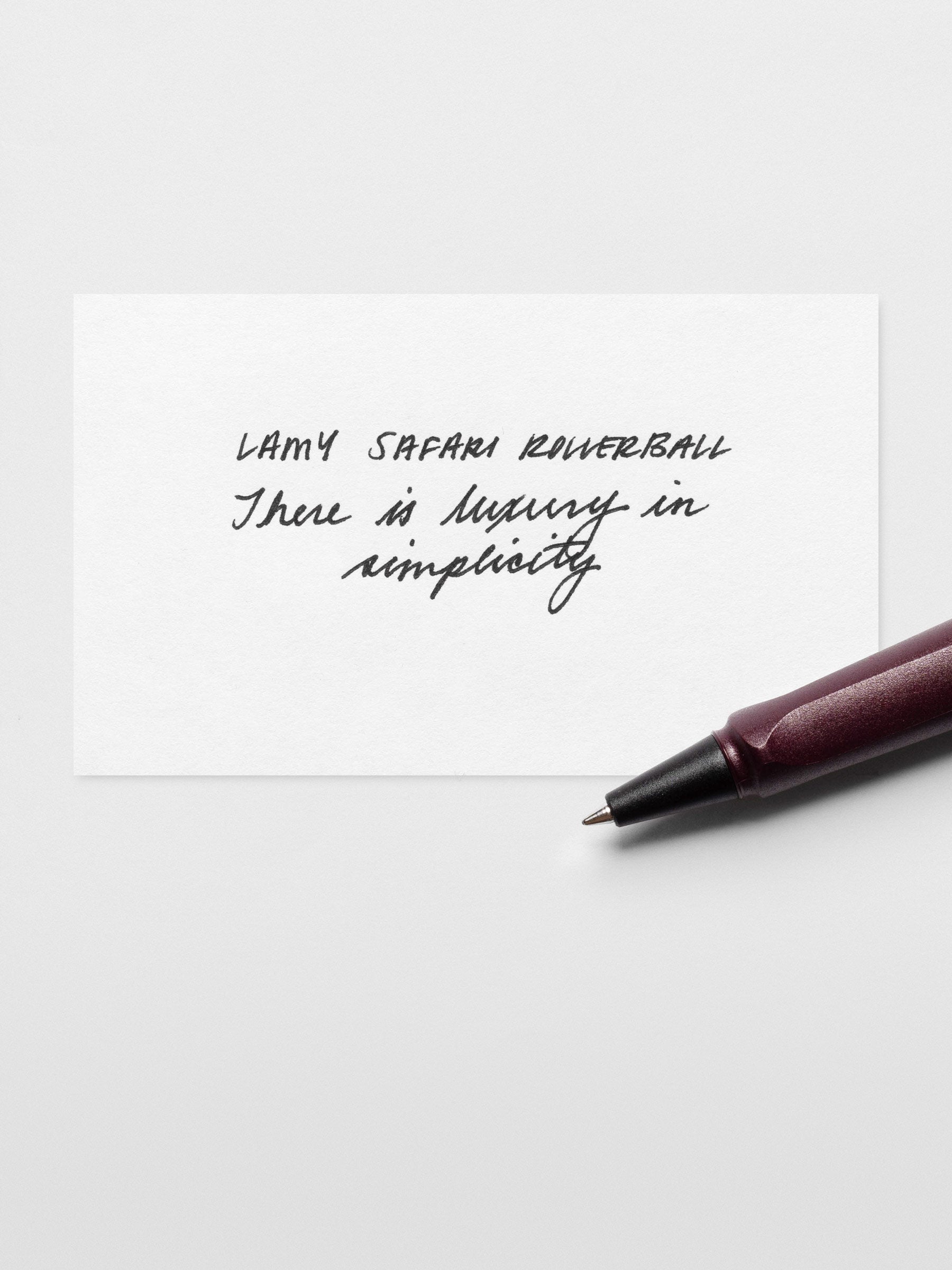 Handwritten writing sample using the LAMY Safari Rollerball Pen | Scarlett | 0.7 mm; shown laying across the paper.