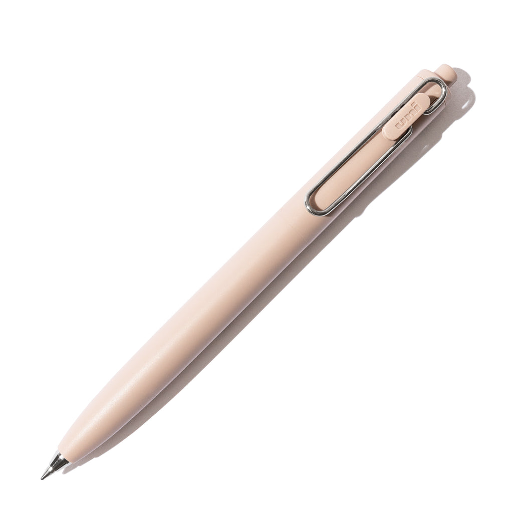 Beige pen turned to the right against a white background.