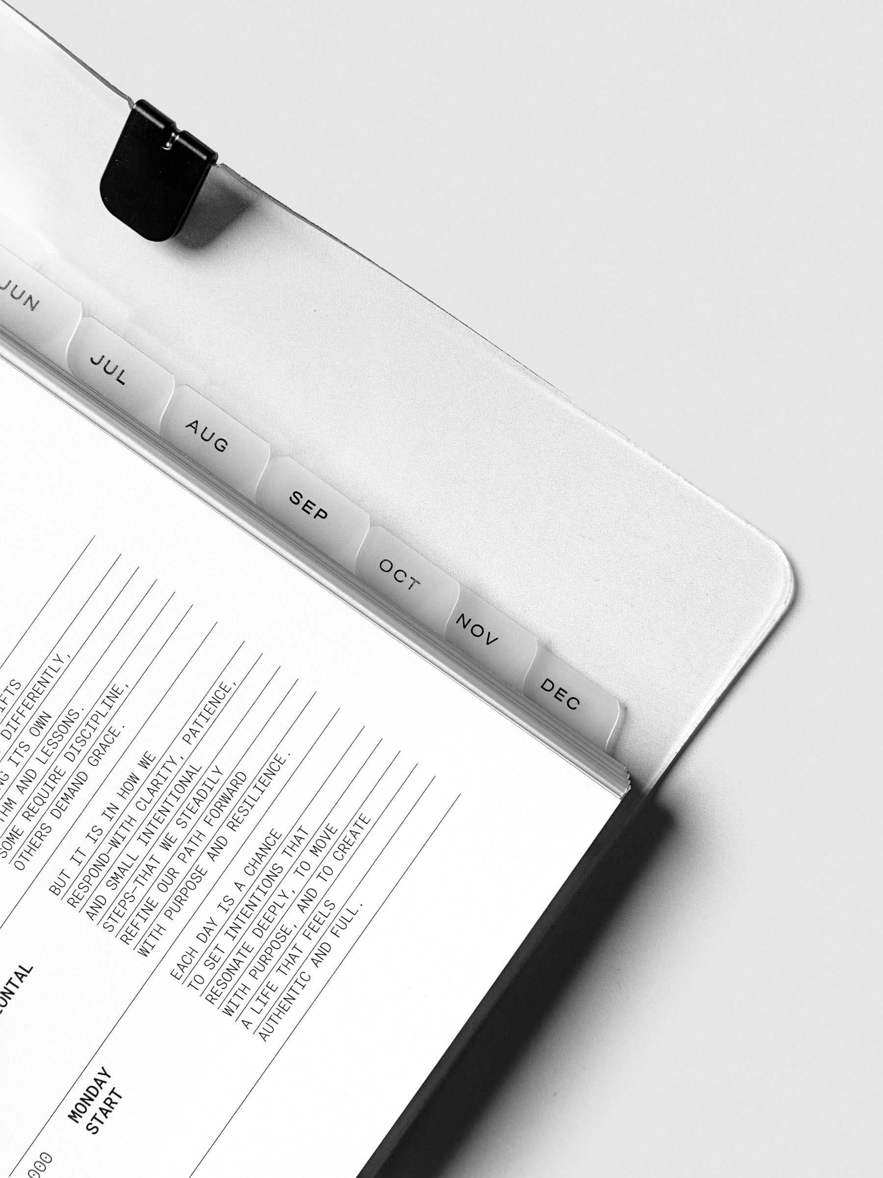 Close up of the monthly side tab dividers included with the 2026 Dated Planner Bundle Horizontal Weekly Monday Start in size A5.