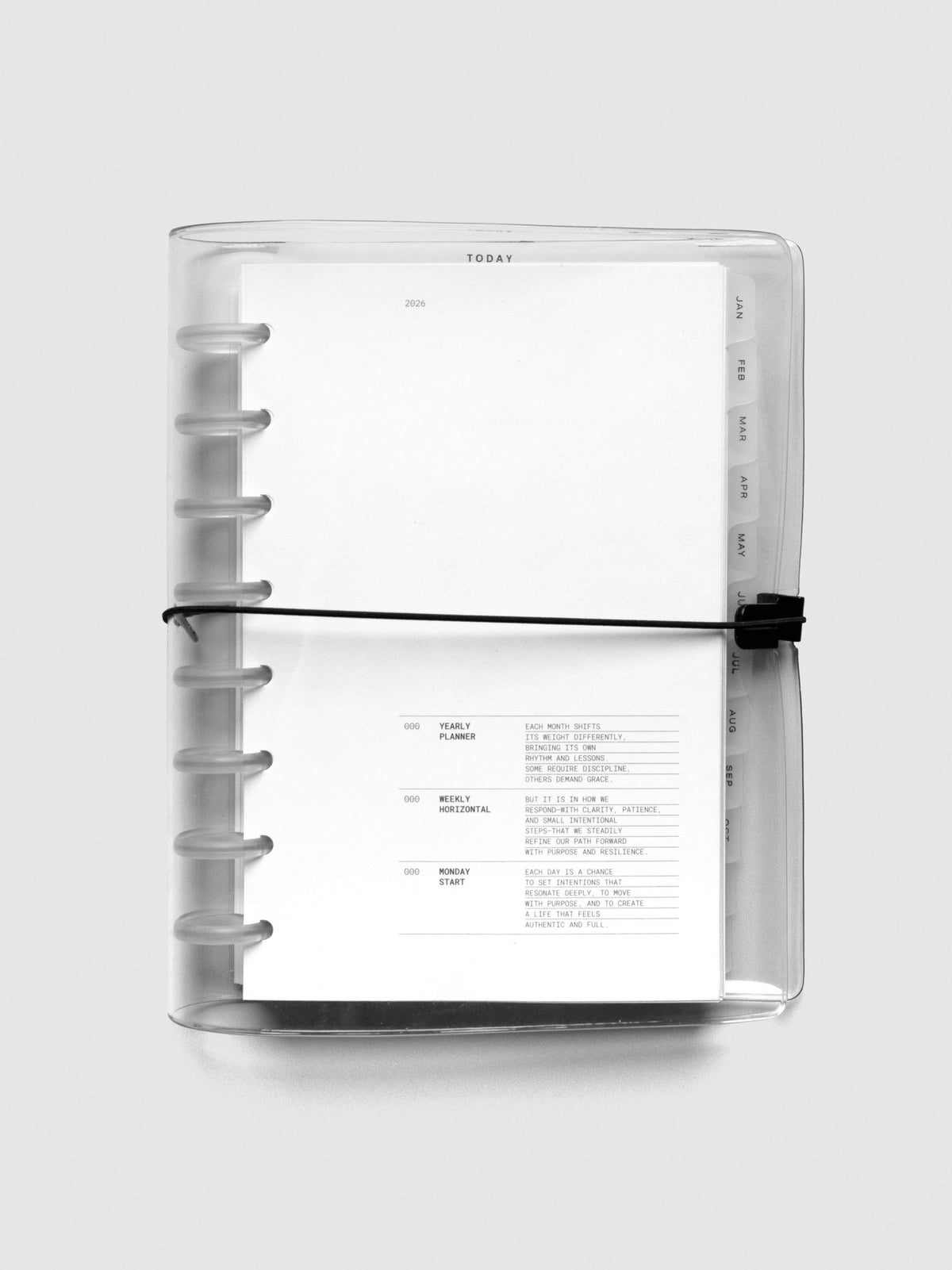 2026 Dated Planner Bundle Horizontal Weekly Monday Start in size Half Letter shown closed in a Clear Vinyl Planner Cover.