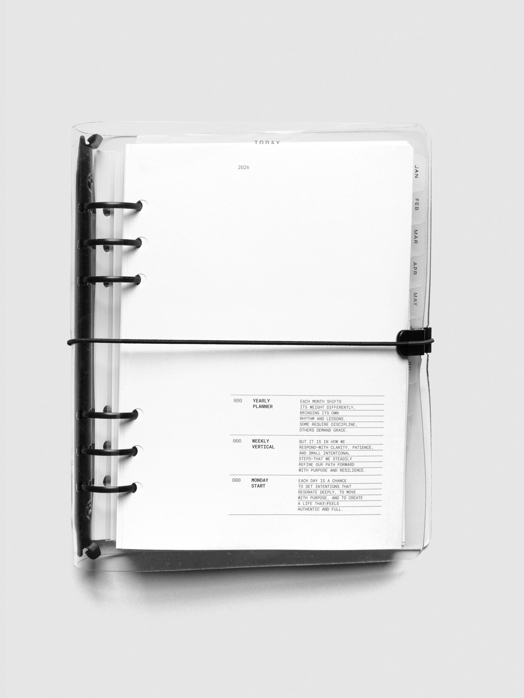 Top-down view of A5 bundle fully assembled in clear vinyl discbound cover, showcasing the 2026 dated insert and tab dividers.