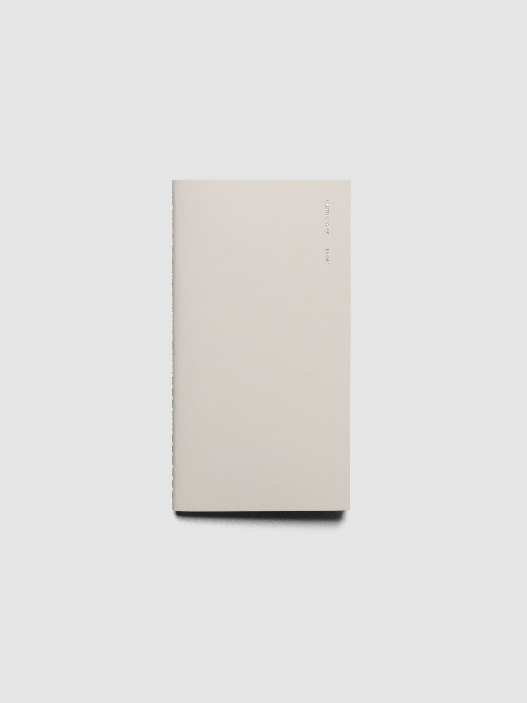 Travel Notebook in size Pocket Plus in color Angora with Blank pages shown closed.