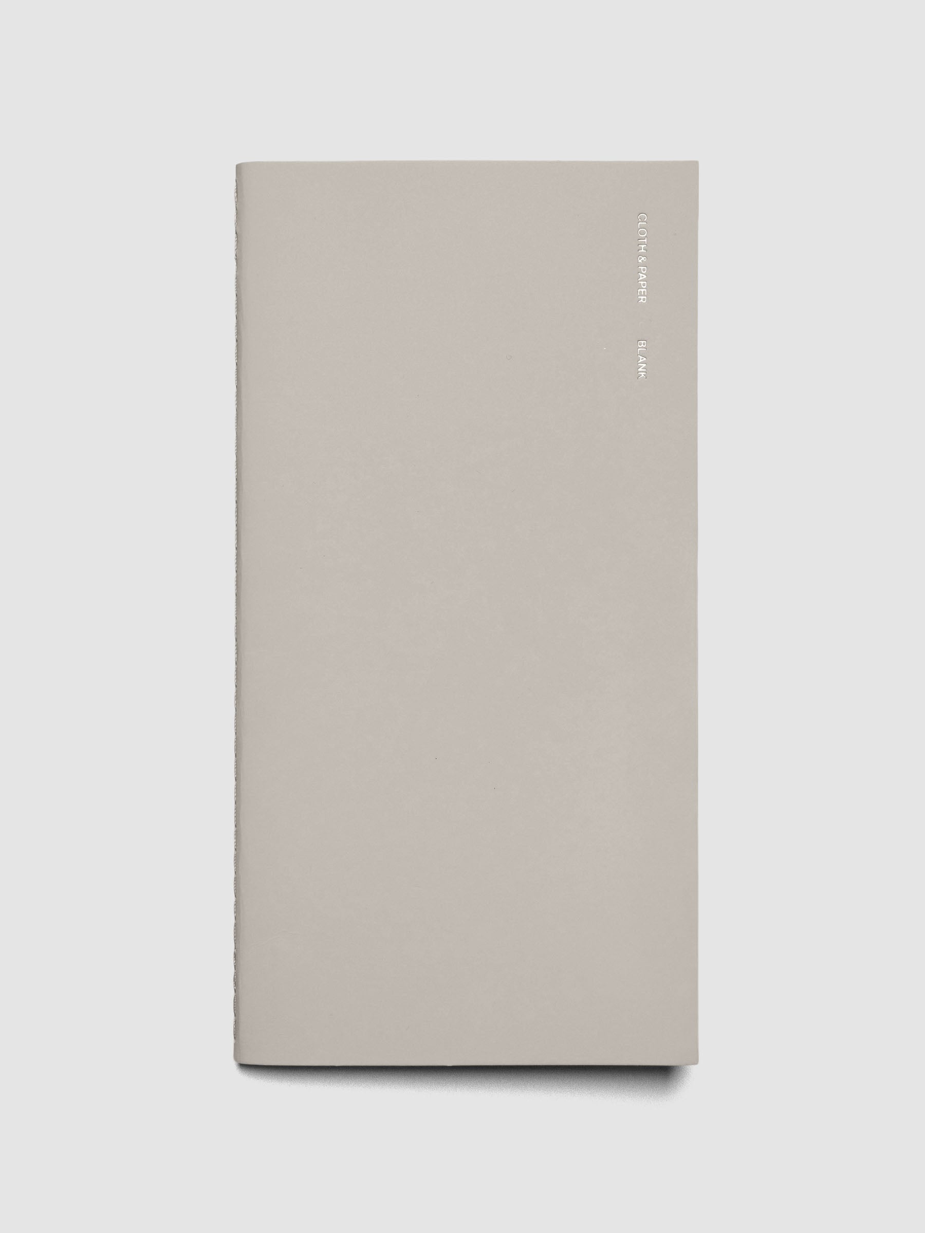 Travel Notebook in size A5 Slim in color Angora with Blank pages shown closed.