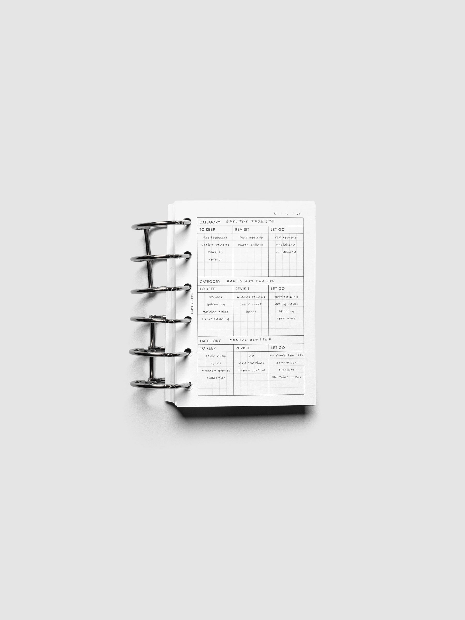 Declutter Planner Inserts in size Pocket shown ring bound with handwritten notes.