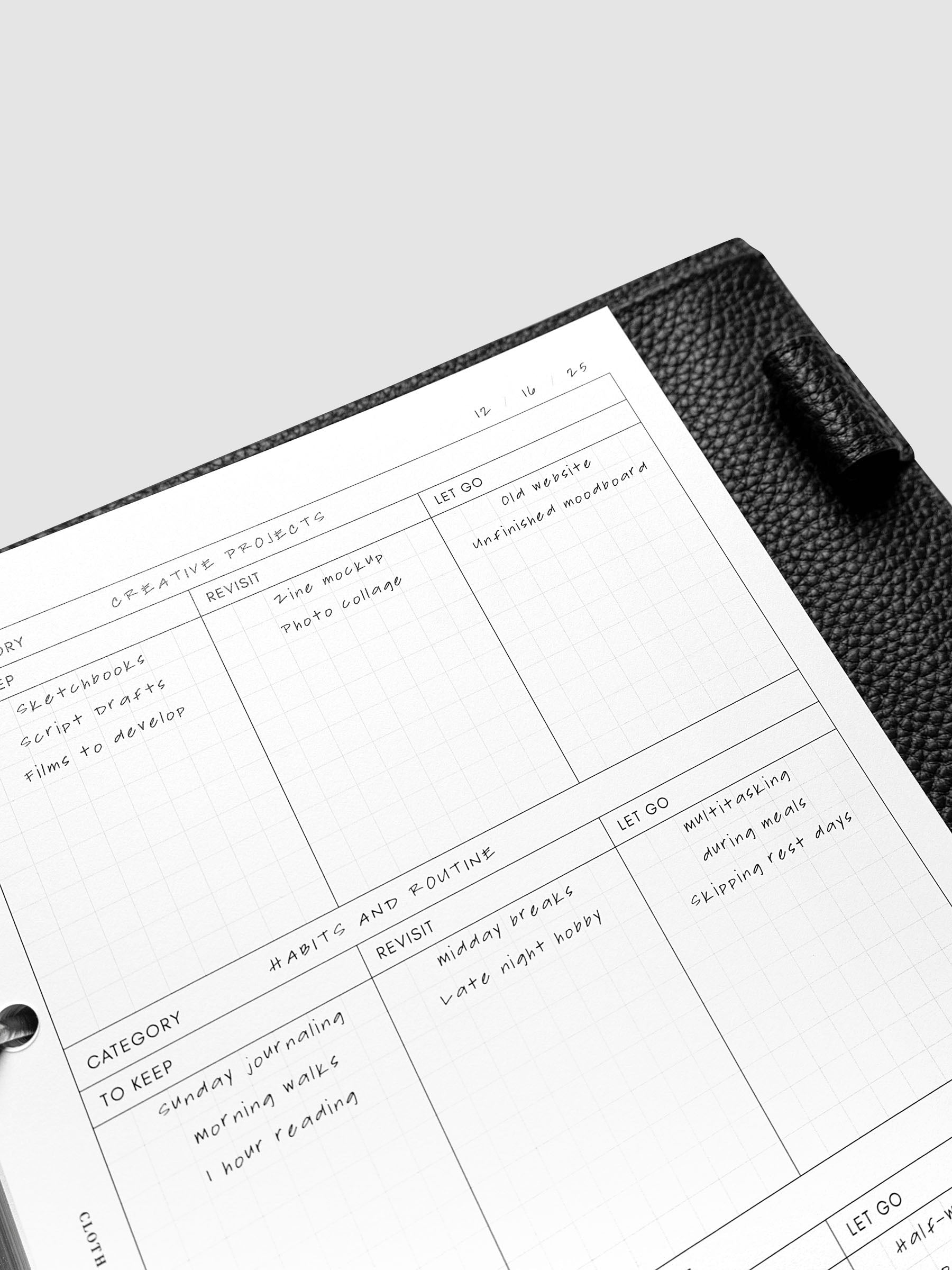 Close up of Declutter Planner Inserts with handwritten notes.