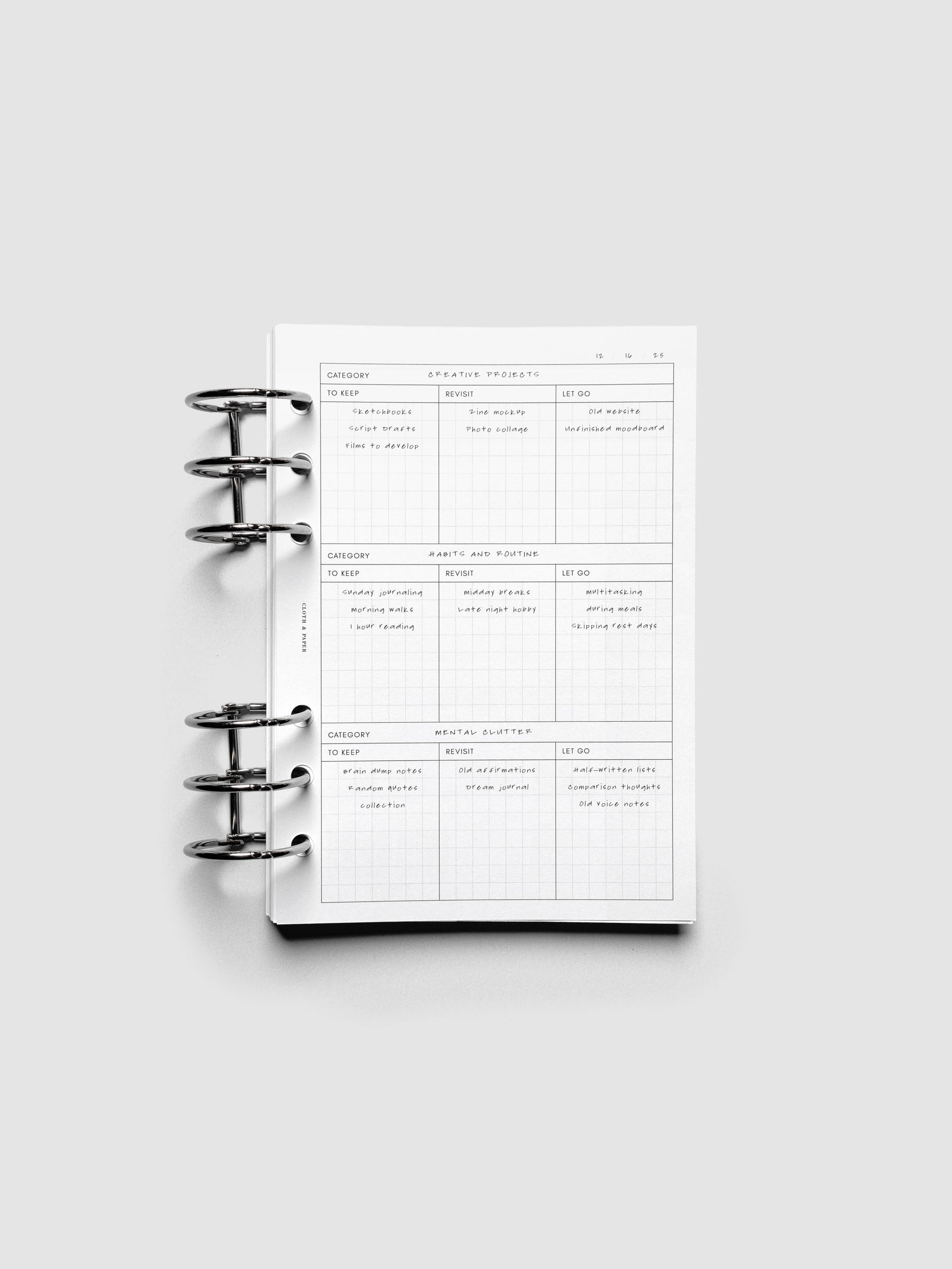 Declutter Planner Inserts with handwritten notes in size Personal Wide shown ring bound.