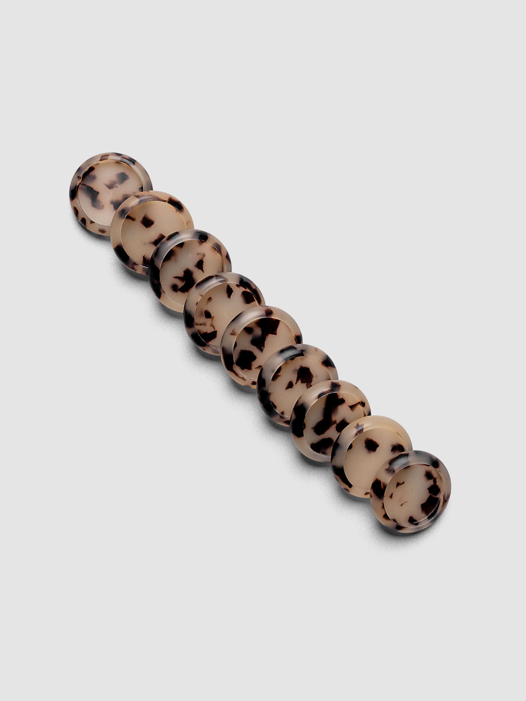 Plastic Planner Discs in the pattern Desert Tortoiseshell shown in 0.75" Inch sizing.