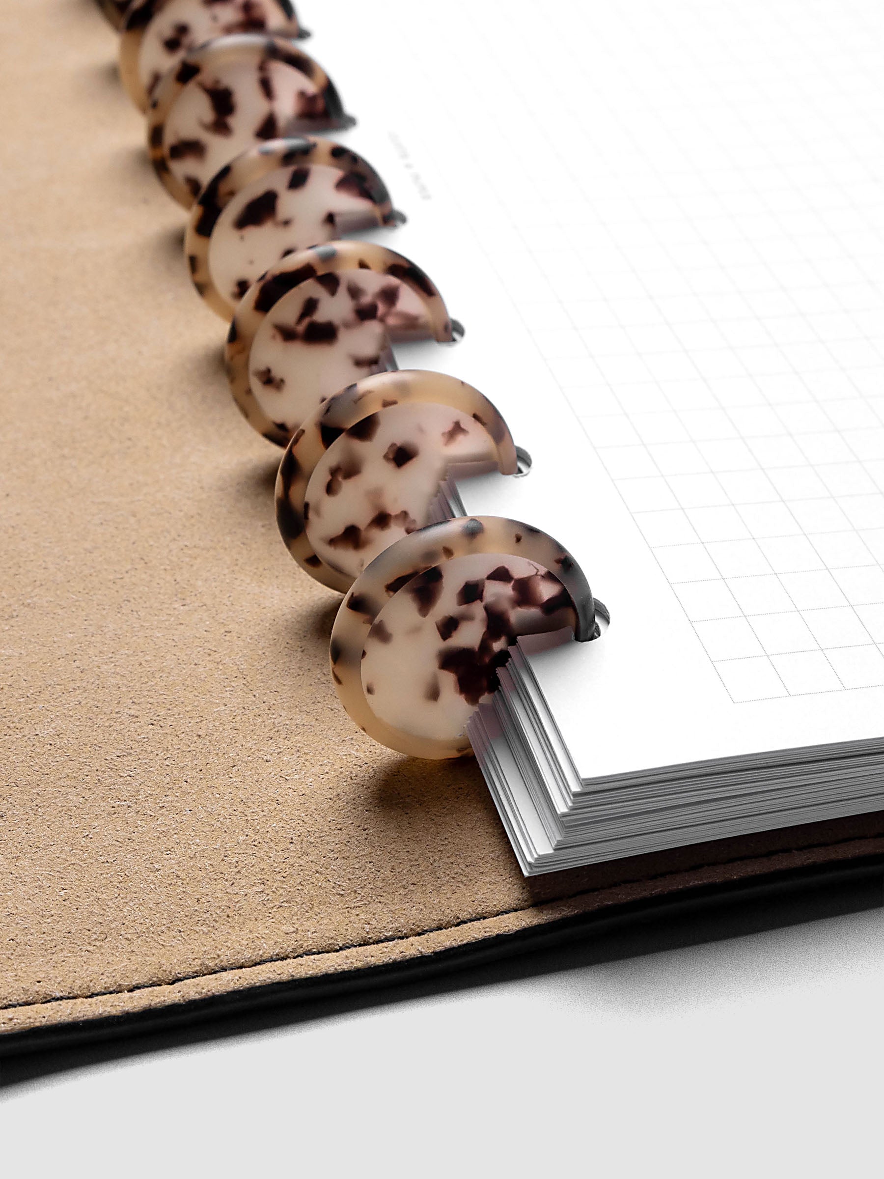1" Inch Desert Tortoiseshell Planner Discs shown in use as binding with planner inserts.