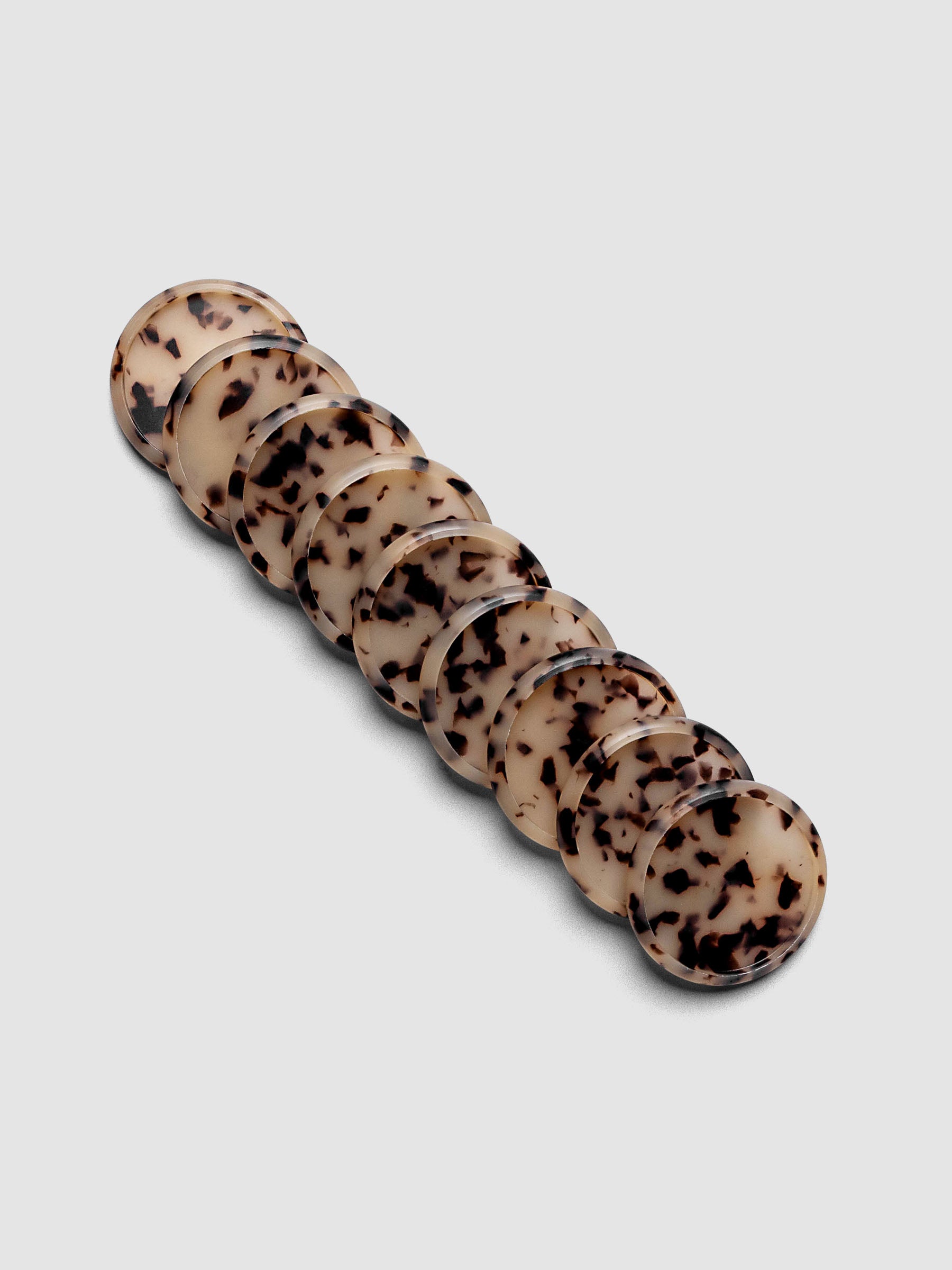 Plastic Planner Discs in the pattern Desert Tortoiseshell shown in 1.25" Inch sizing.