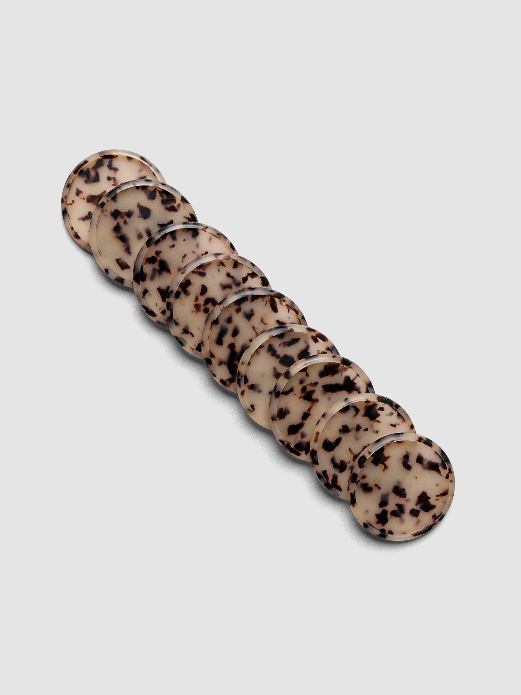 Plastic Planner Discs in the pattern Desert Tortoiseshell shown in 1.5" Inch sizing.