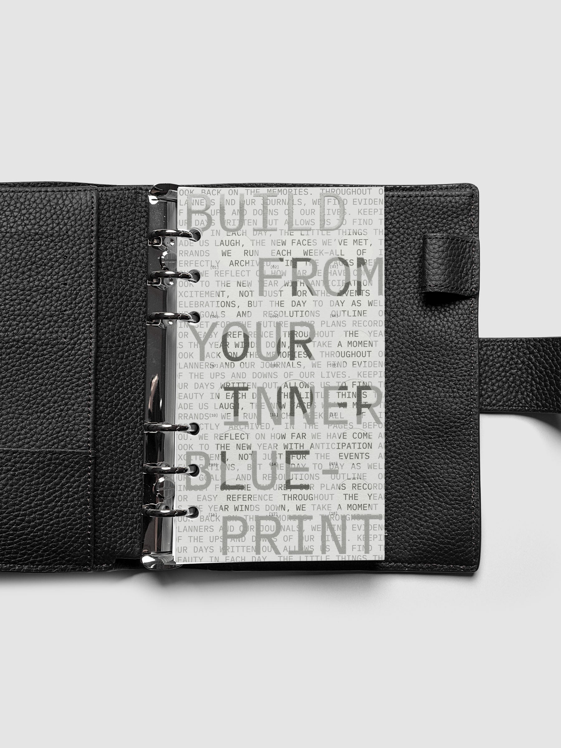 Inner Blueprint Dashboard Duo shown ring bound in a black leather agenda in size Personal.