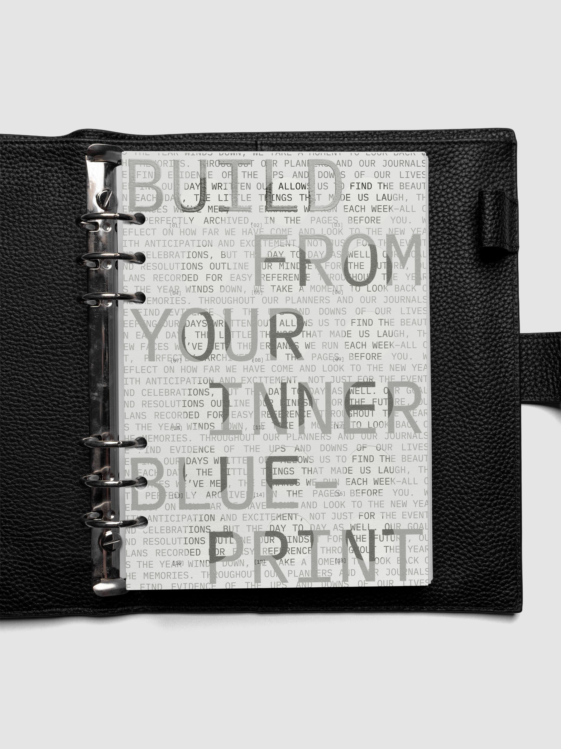 Inner Blueprint Dashboard Duo shown ring bound in a black leather agenda in size A5.