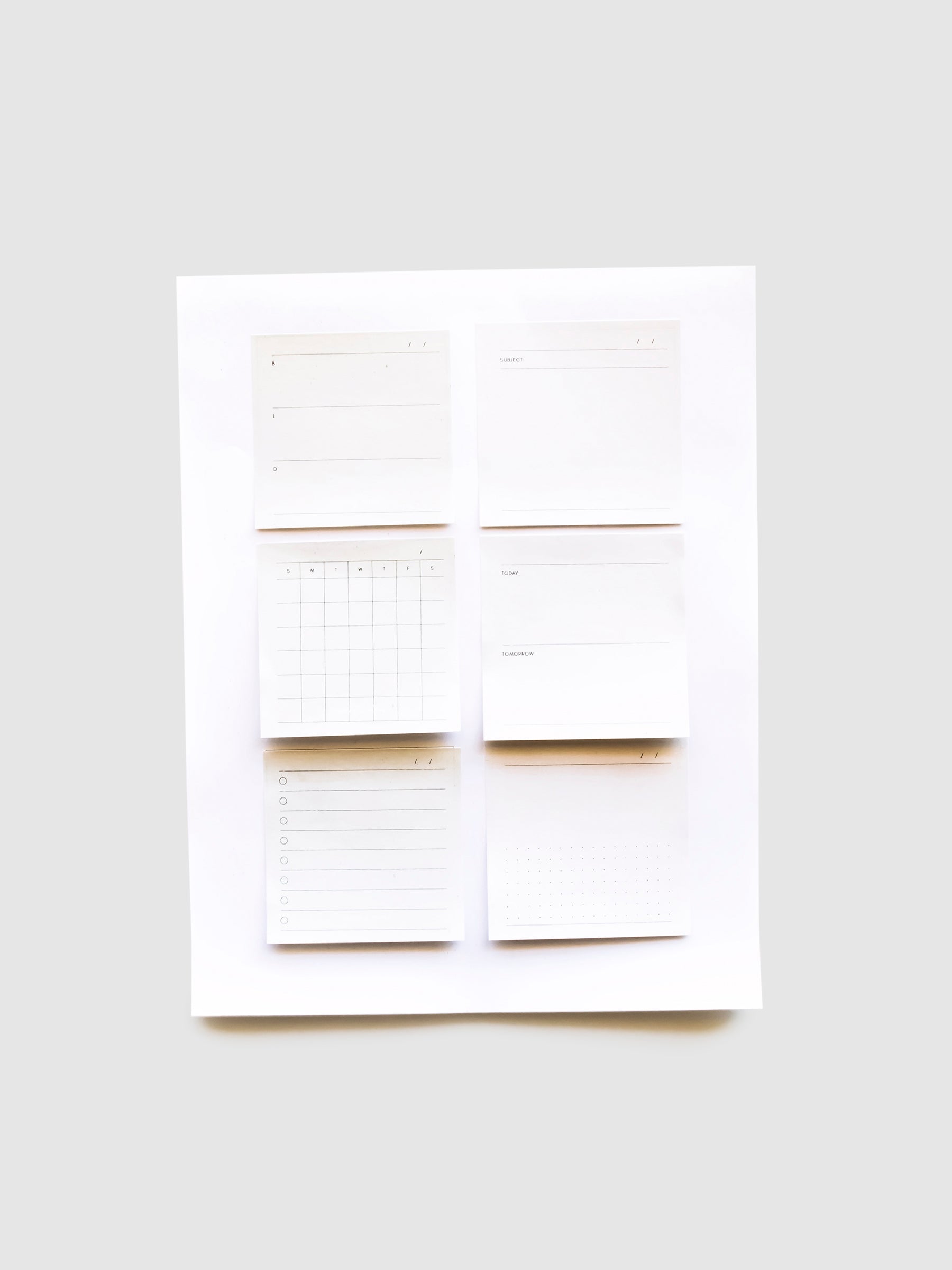 Sticky notes stuck to the printer paper with guides for sticky note placement.