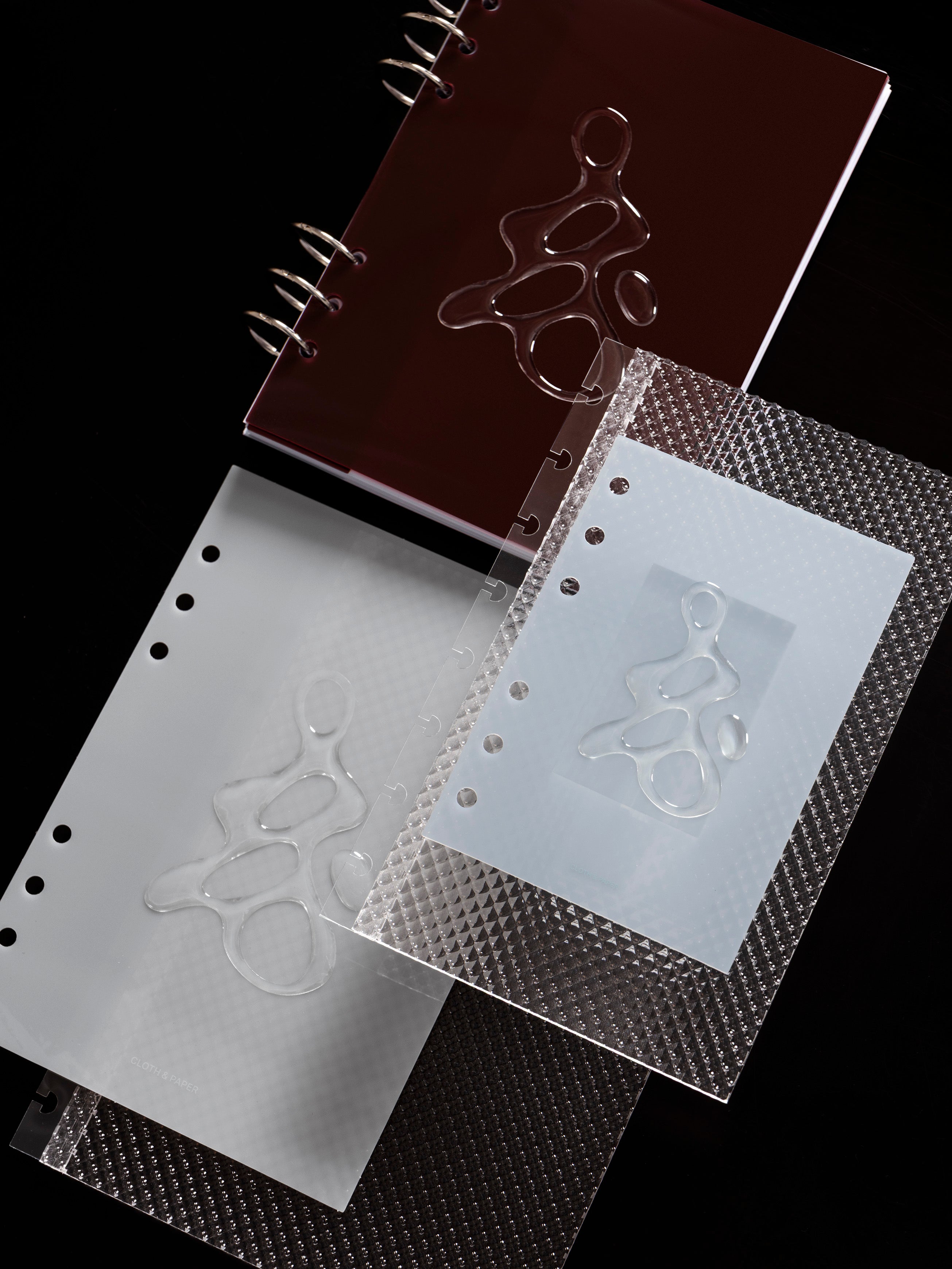 All three colors of the Gloss Form Planner Dashboard shown with the Studded Planner Dashboard against a dark background.