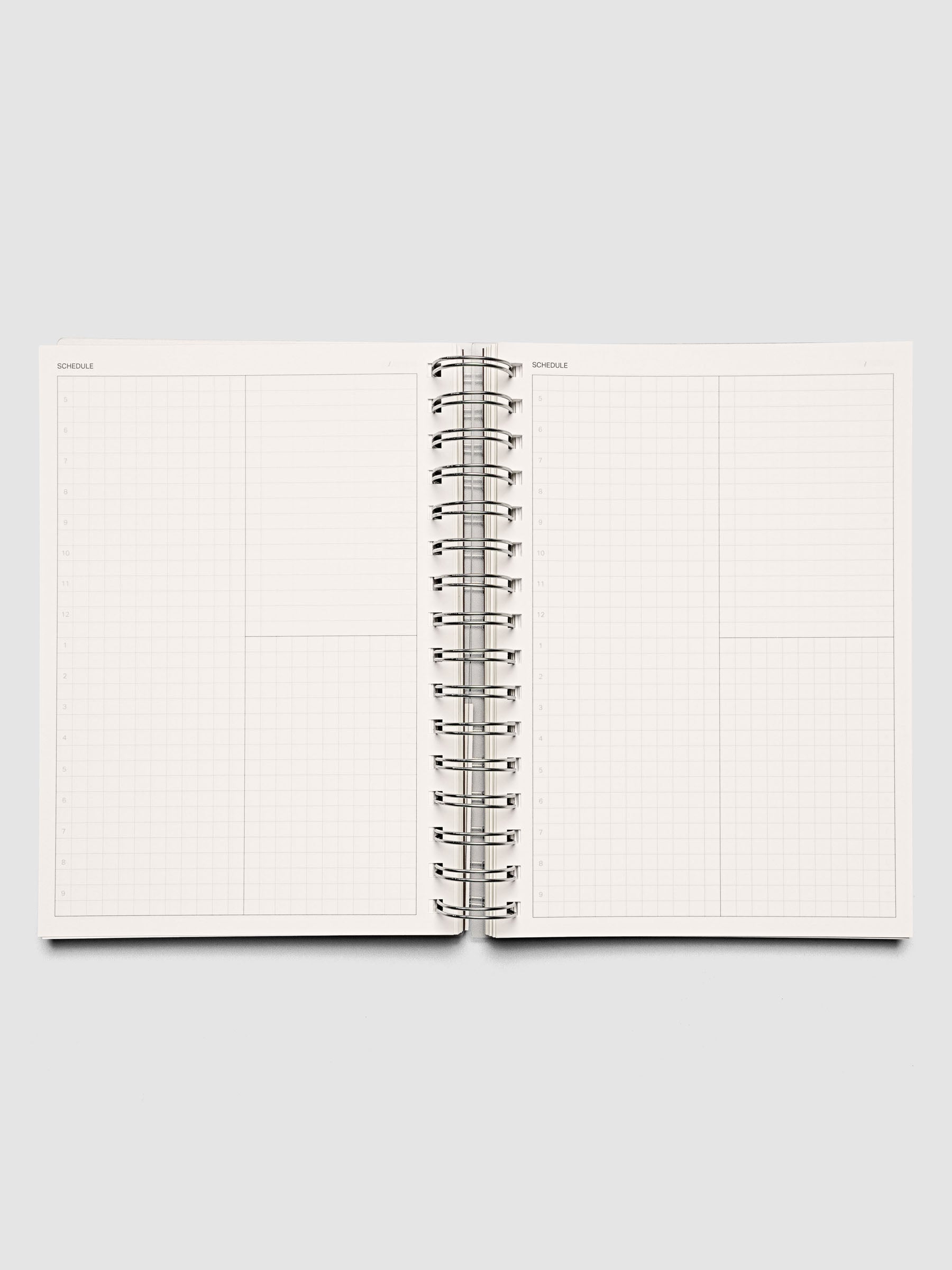 Spiral Notebook in size A5 and color Espresso brown with Daily Time Block interior pages shown open.