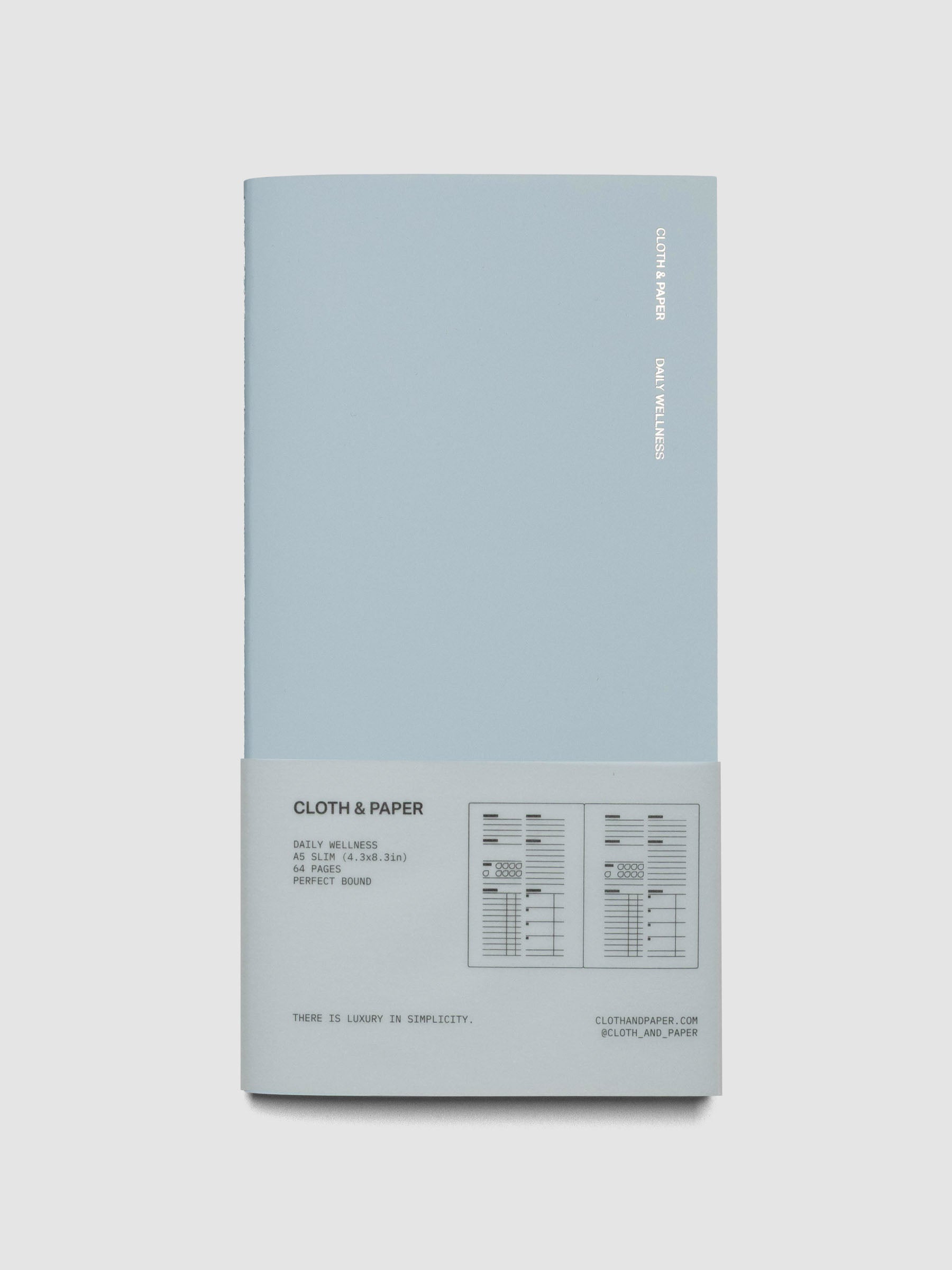 Travel Notebook in size A5 Slim in color Smoked Salt with Daily Wellness pages shown closed in packaging.