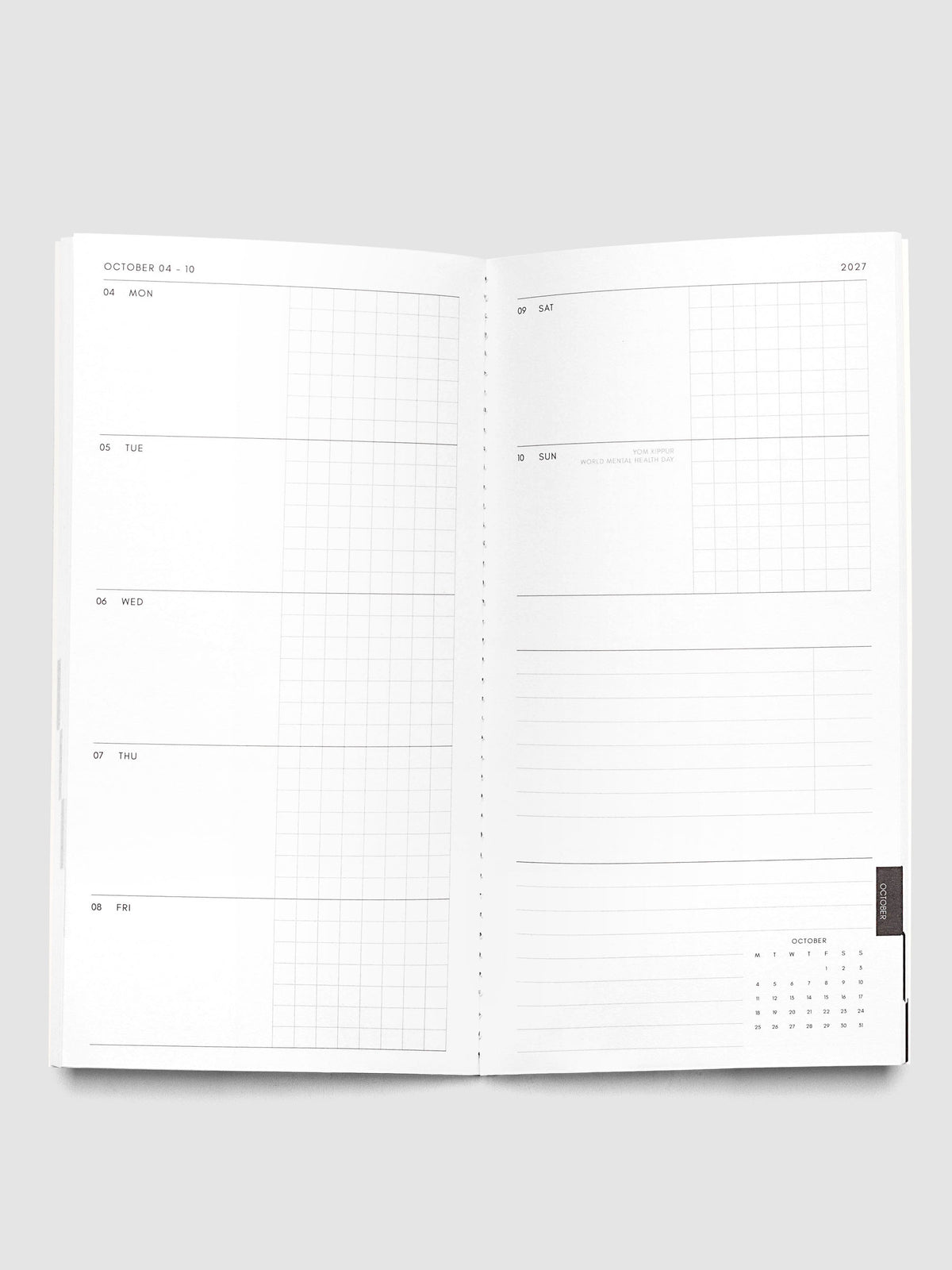 Open Jul–Dec 2027 Dated Travel Notebook showing the full weekly spread, with split daily columns on the left page and weekend dates, task section, notes section, and month-at-a-glance on the right