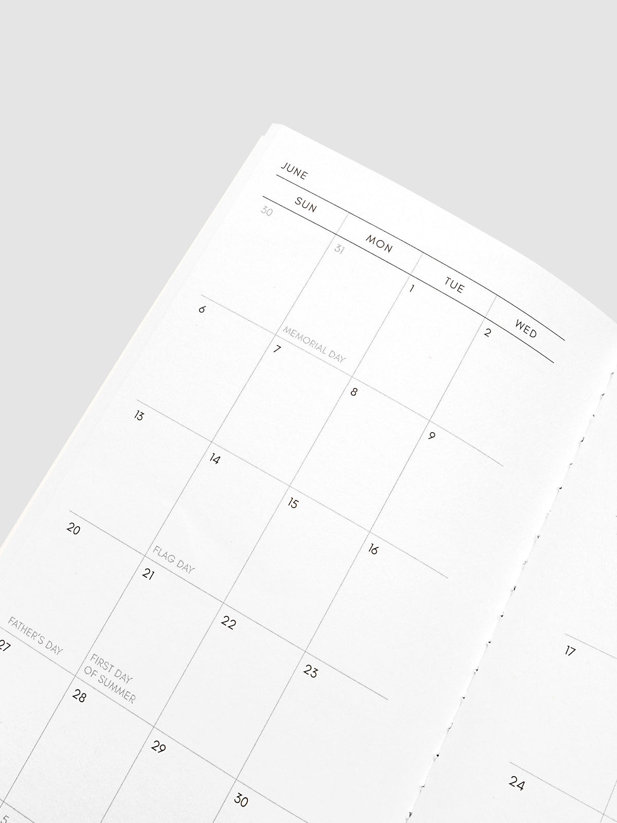 Close-up of the top of the left page of the 2027 Dated Travel Notebook Monthly in Pocket Plus size, showing the dated calendar grid
