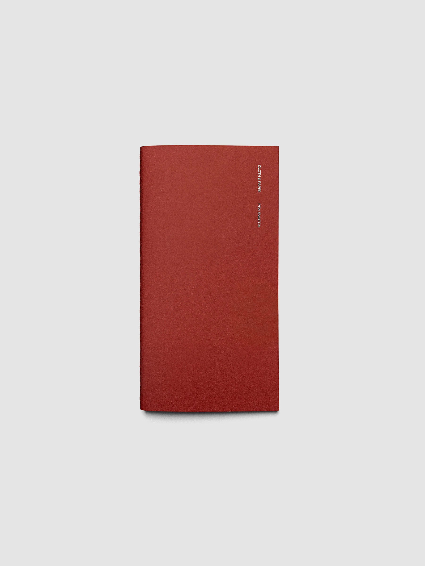 Travel Notebook Pen Swatch Pocket Plus in Merlot, red cover with silver foil text