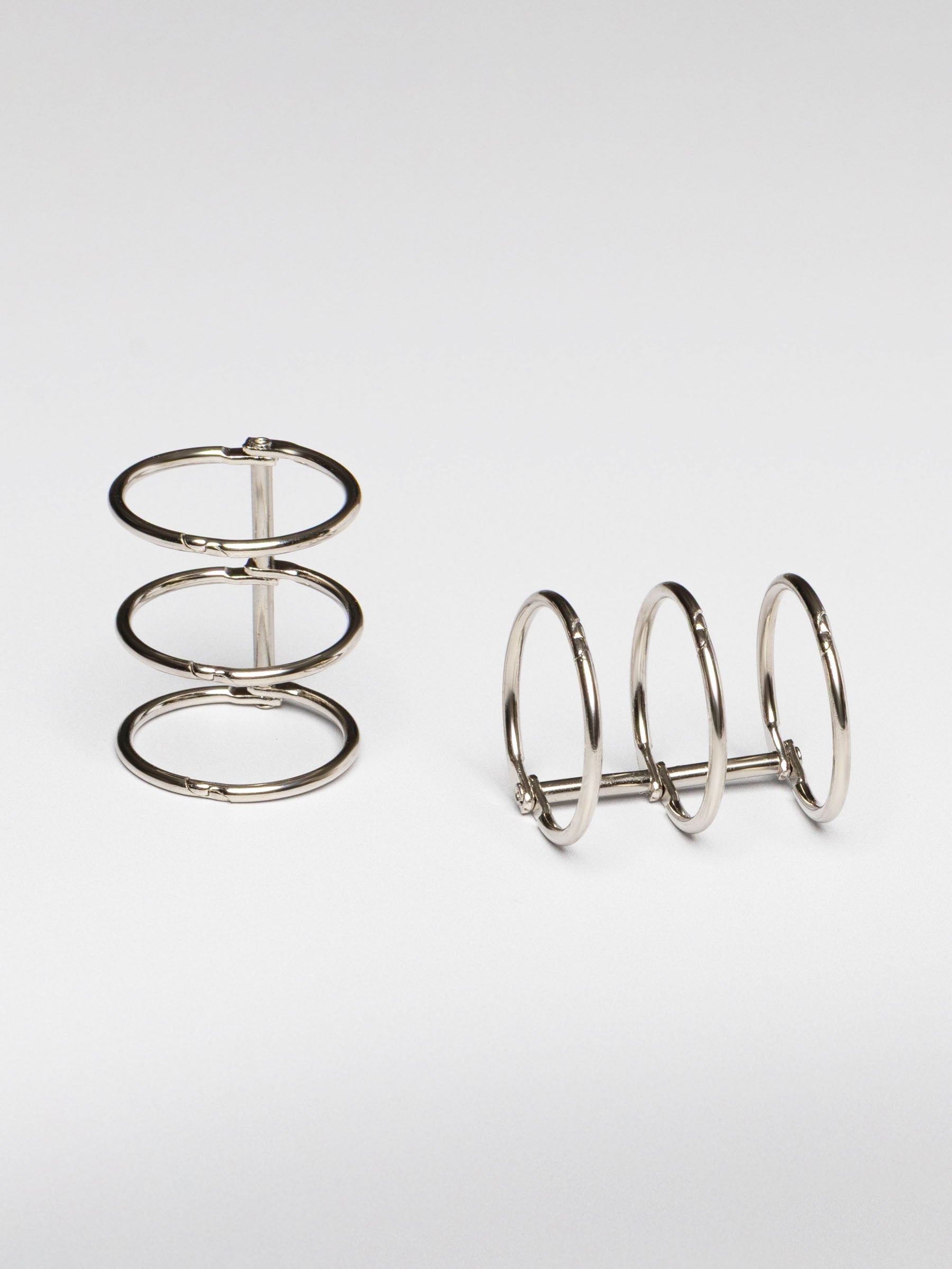 Planner rings displayed on a neutral background. Color shown is silver.