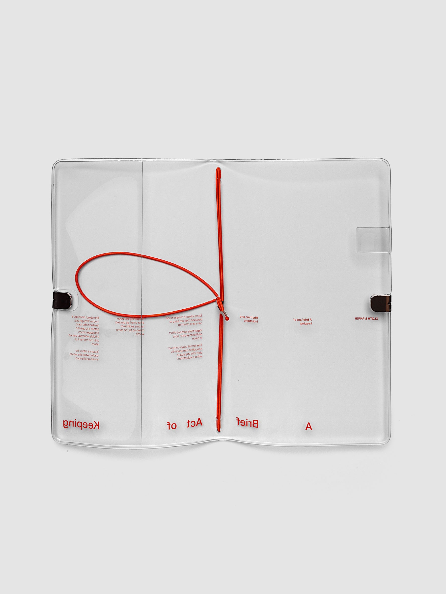 Act of Keeping Travel Notebook Cover in A5 Slim size, open, showing four deep orange interior bands, pen loop, and front pocket