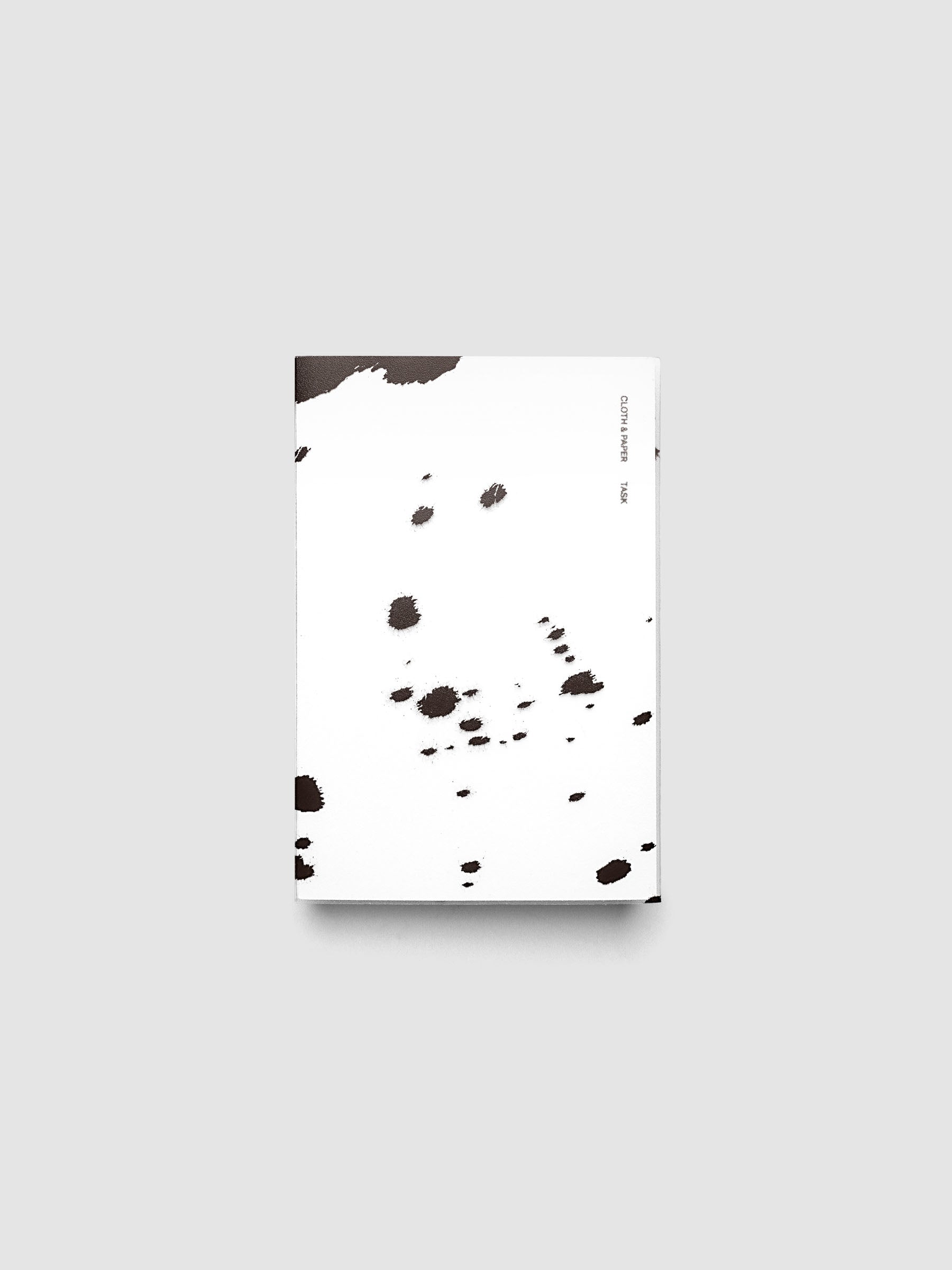 CP Petite frosted plastic notebook cover with brown dalmatian animal print pattern on a Perfect Bound Notebook