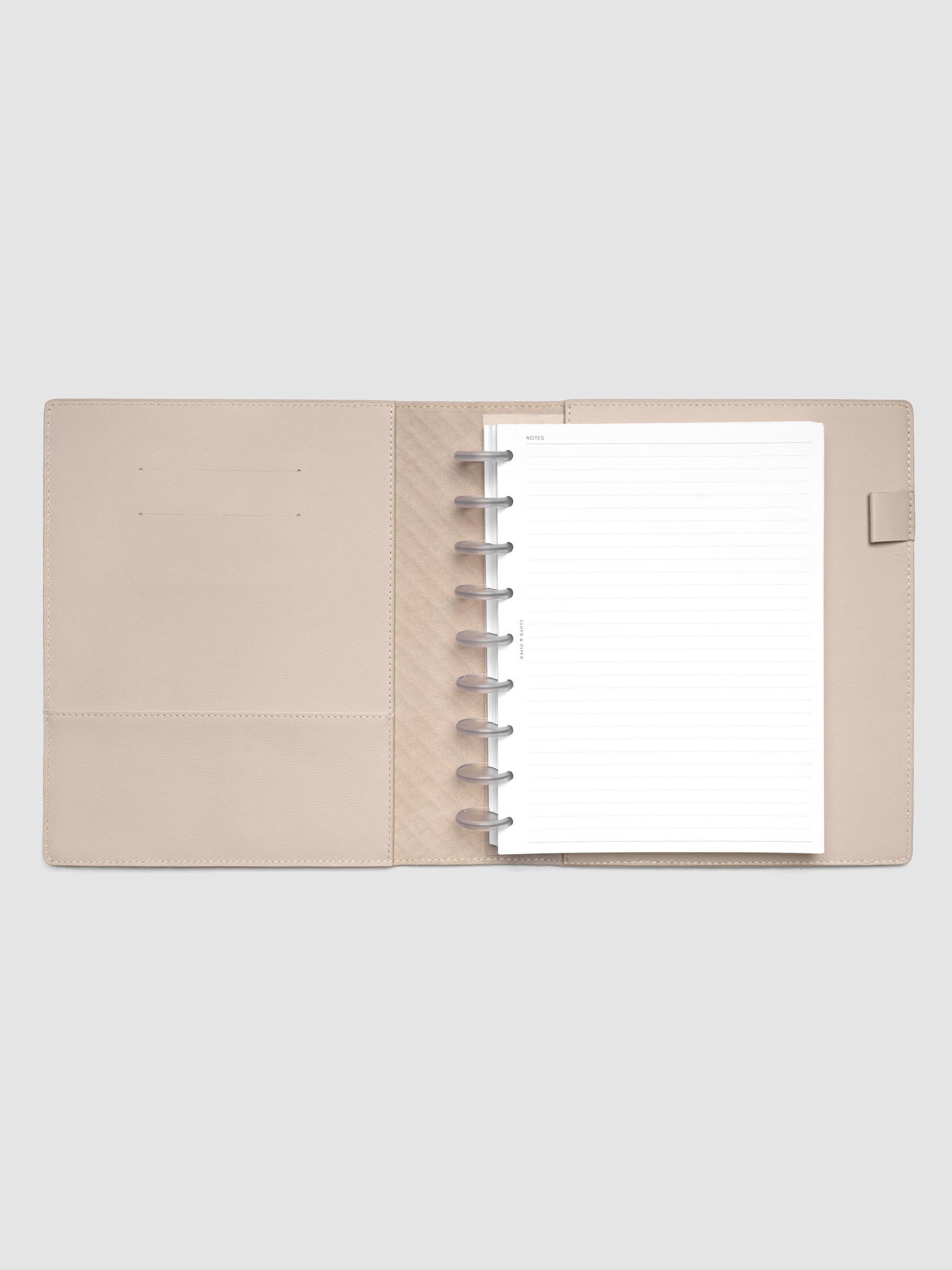 Beige leather planner folio with an HP Classic discbound planner inside.