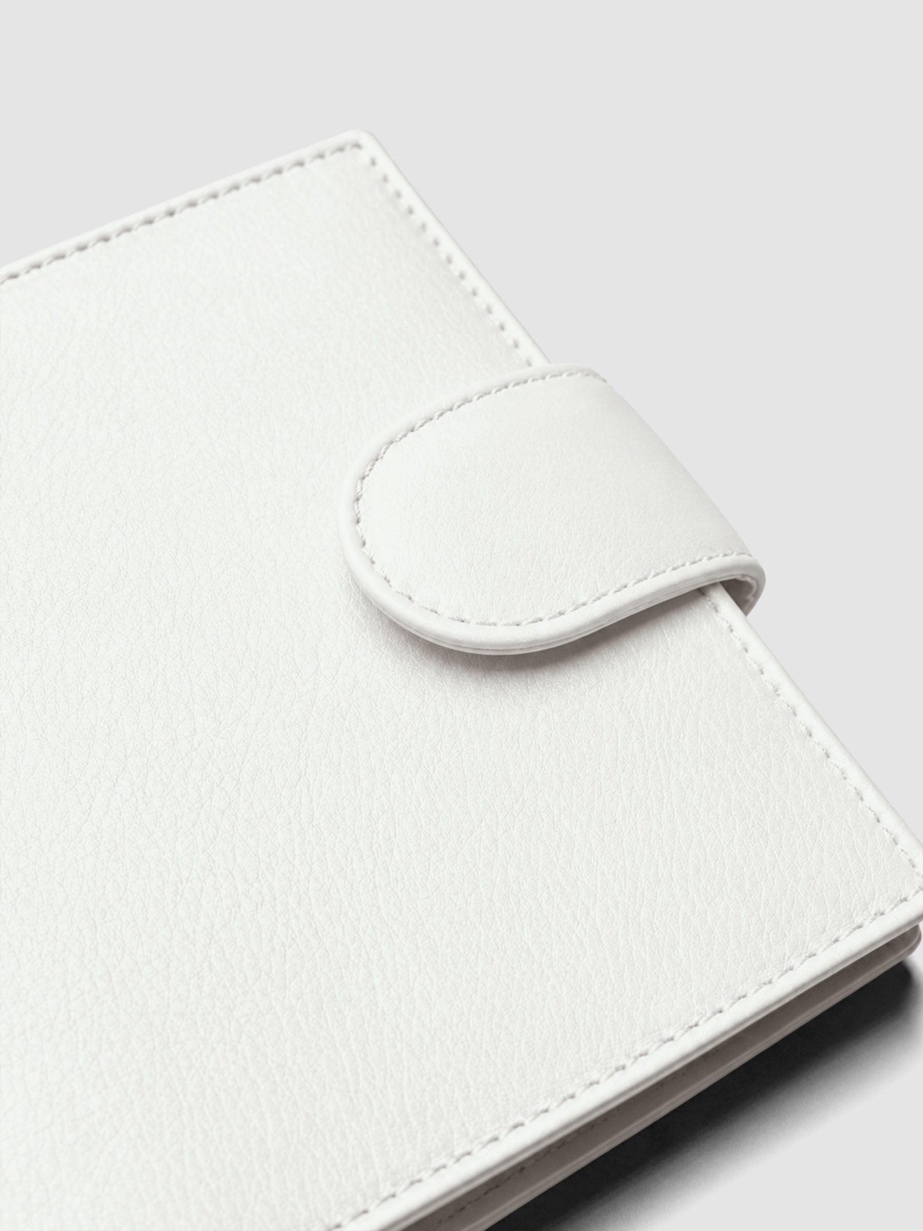 Heirloom Ring Cover Genuine Leather Pocket 6-Ring Punch in off-white, closed planner detail of closure band
