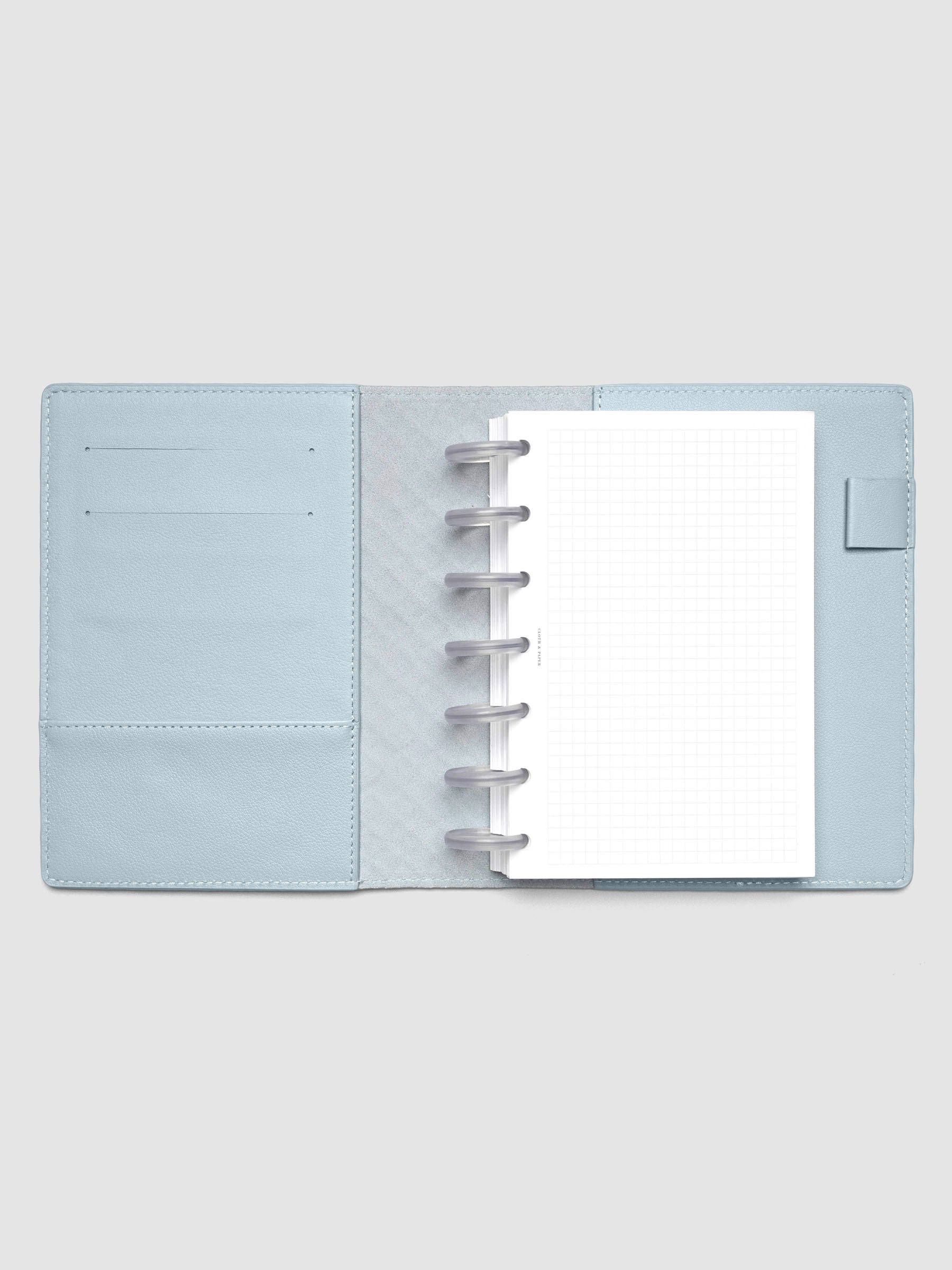 Blue leather planner folio with an HP Mini discbound planner inside.